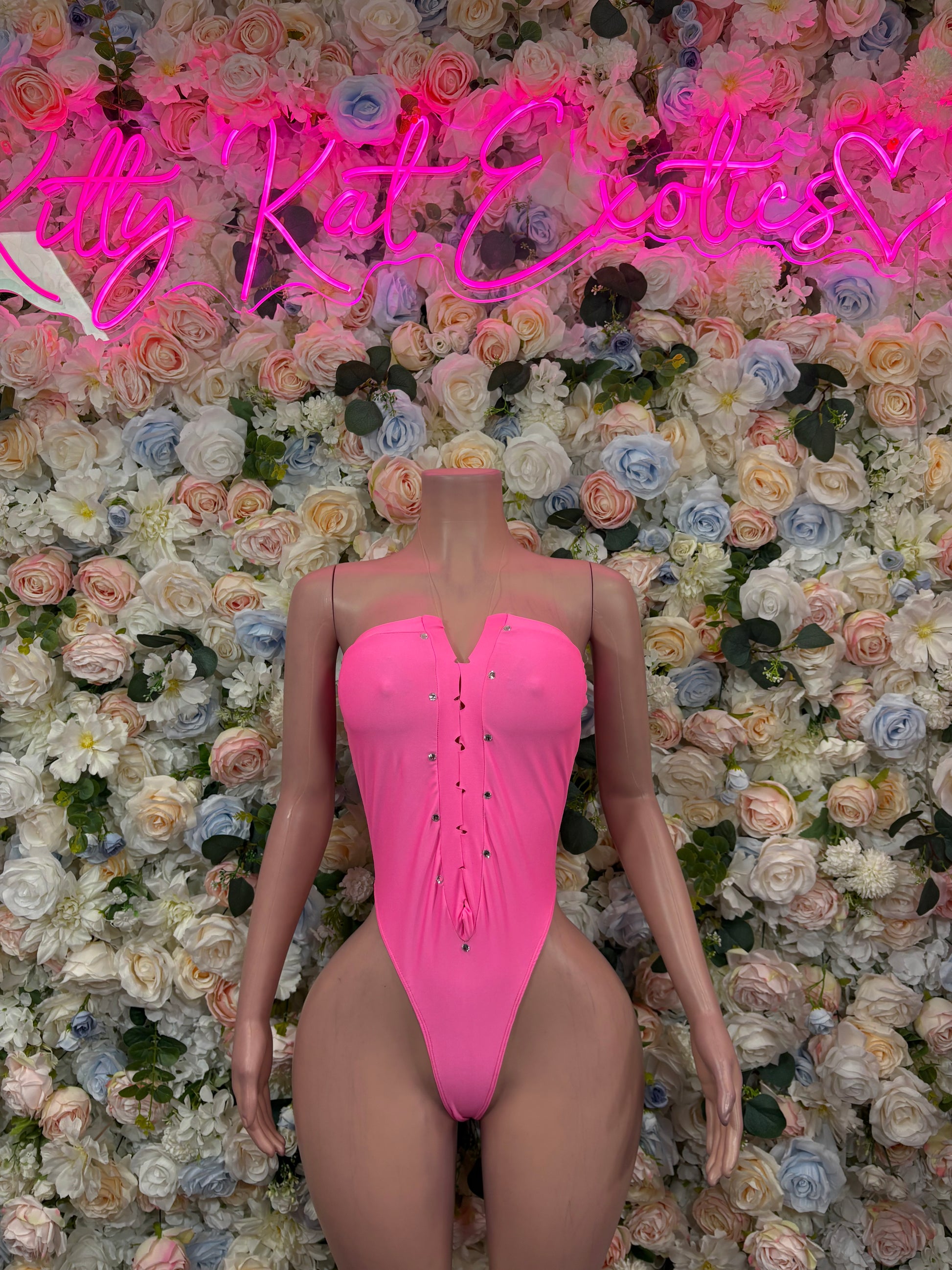 Hot pink V-neck thong bodysuit with corset-style lace-up front