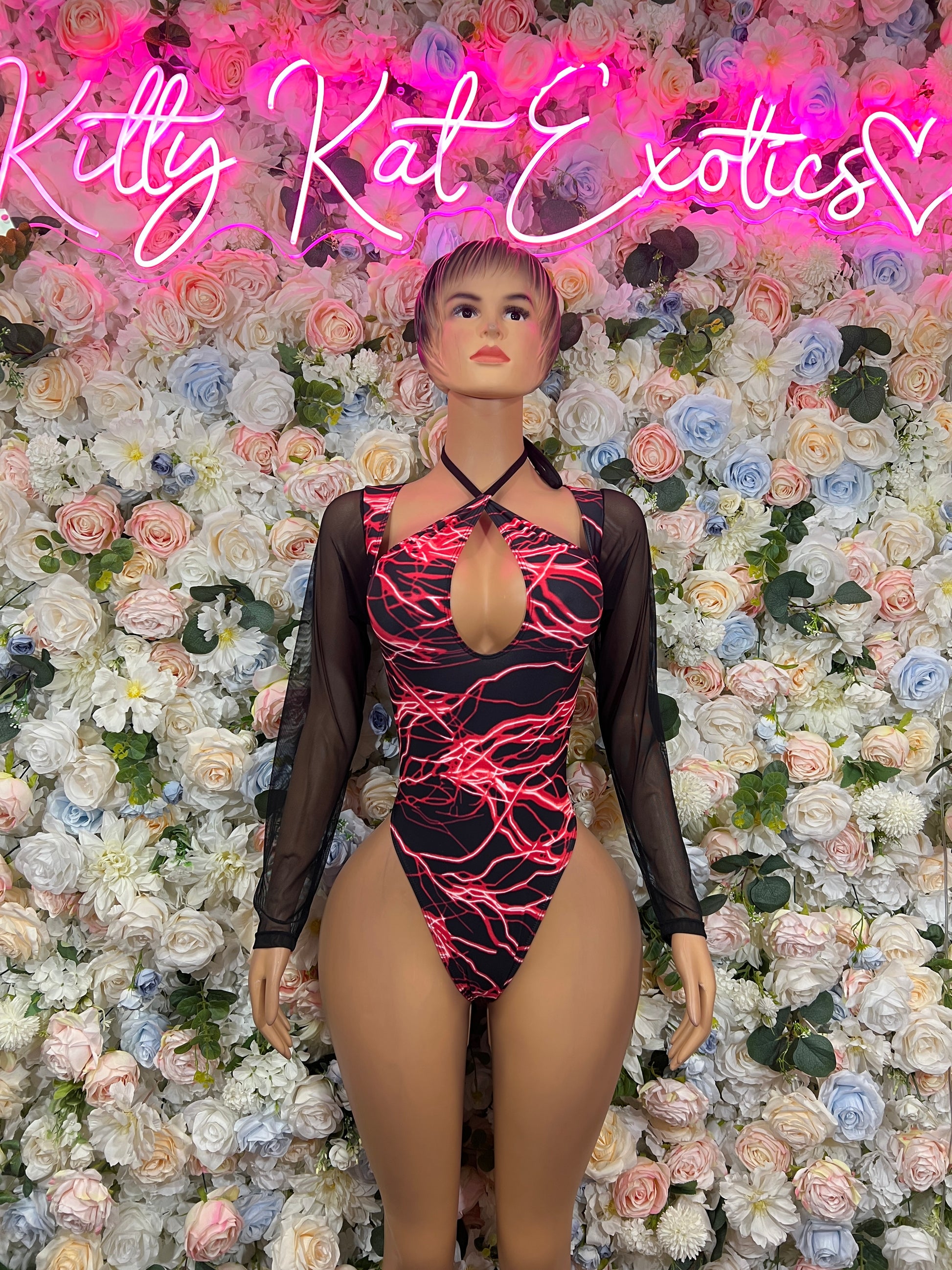 Black sheer bodysuit with red lightning print, keyhole chest cutout and long sleeves