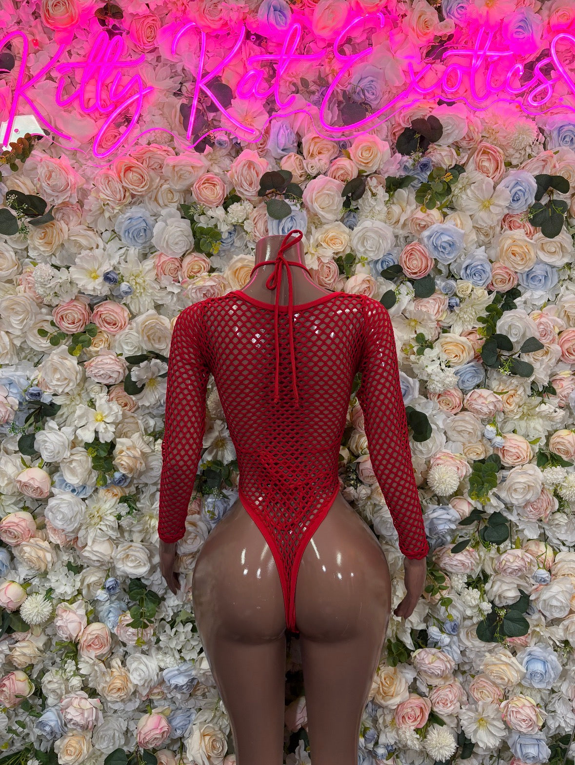 Red fishnet bodysuit with long sleeves, lace-up front, thong cut