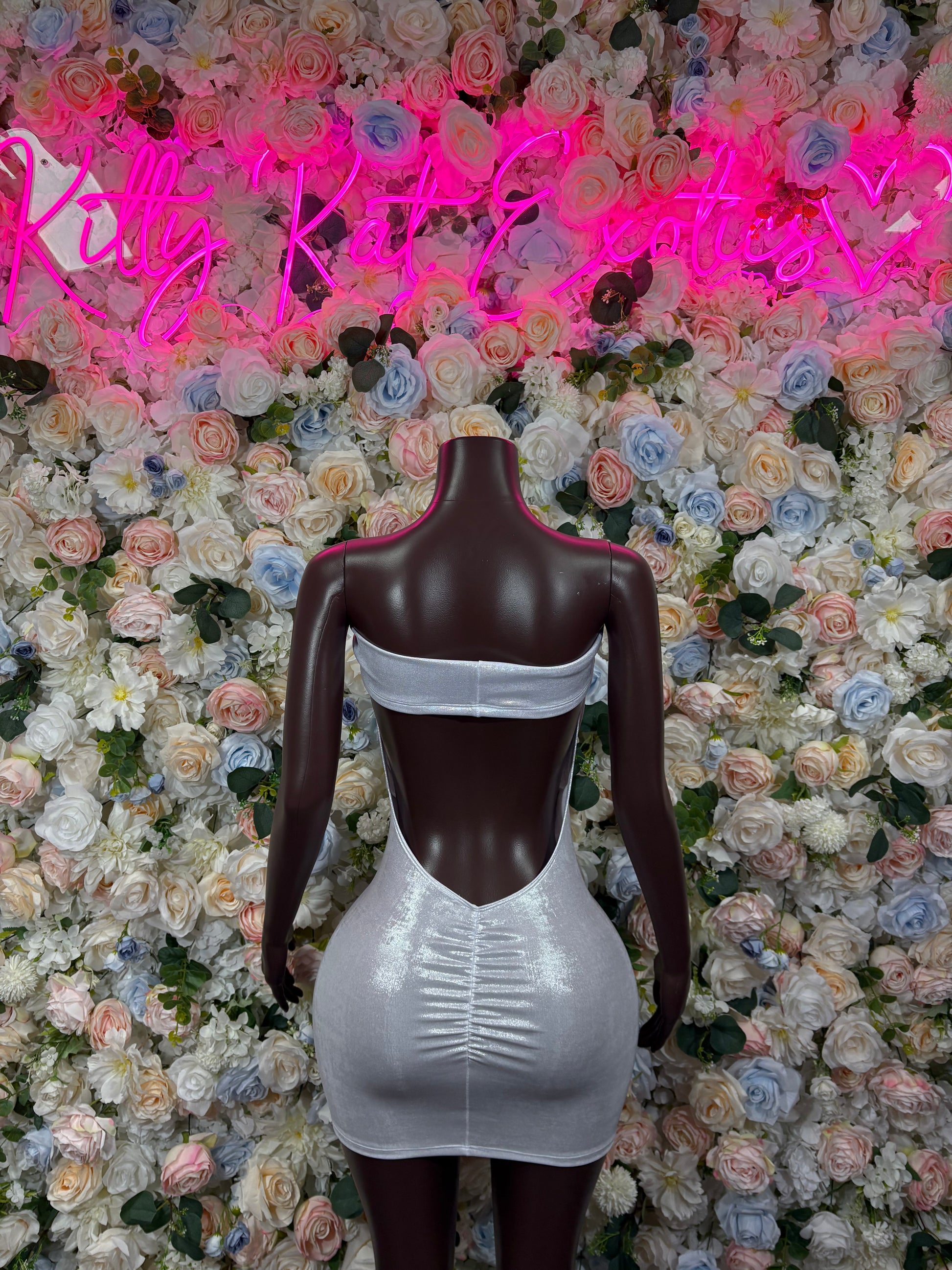 Silver metallic mini dress with open back and wide horizontal strap at top