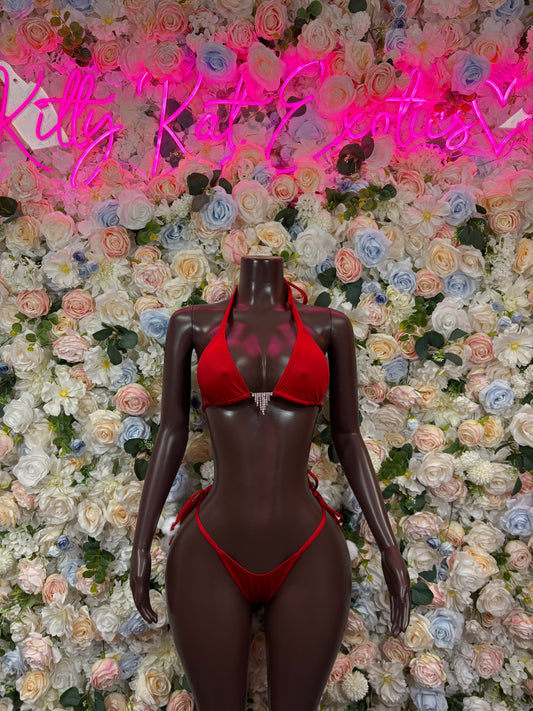 Red velvet two-piece bodysuit on mannequin, triangle bra and thong bottoms