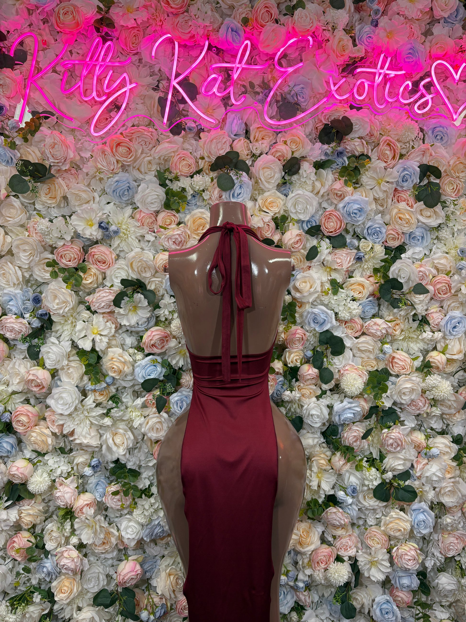Burgundy halter maxi dress with crisscross open-back straps and draped neckline