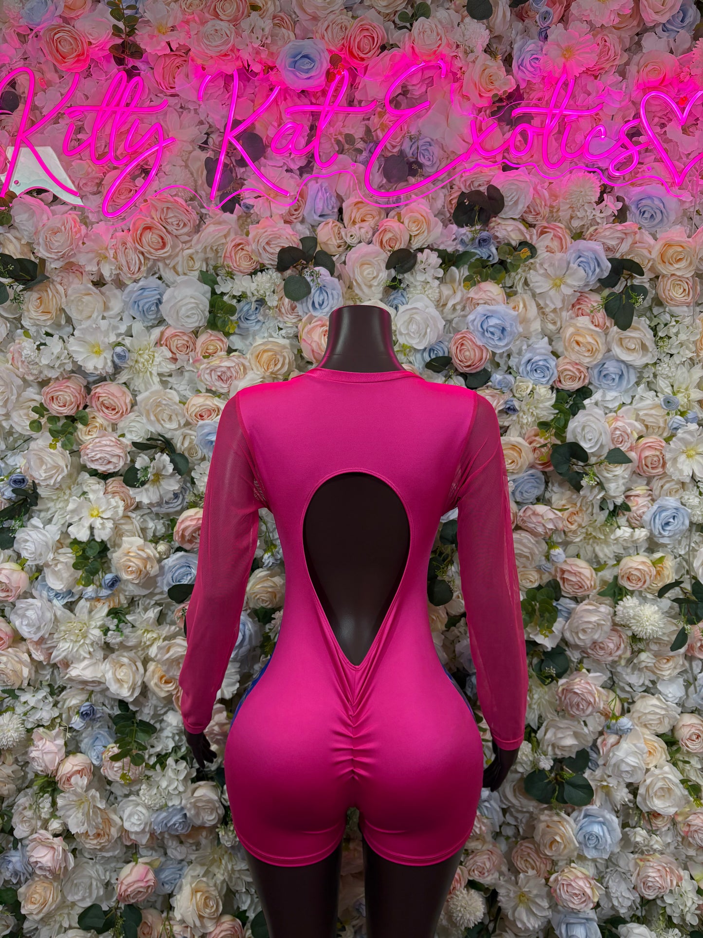 Pink metallic bodysuit with long sleeves and open keyhole back