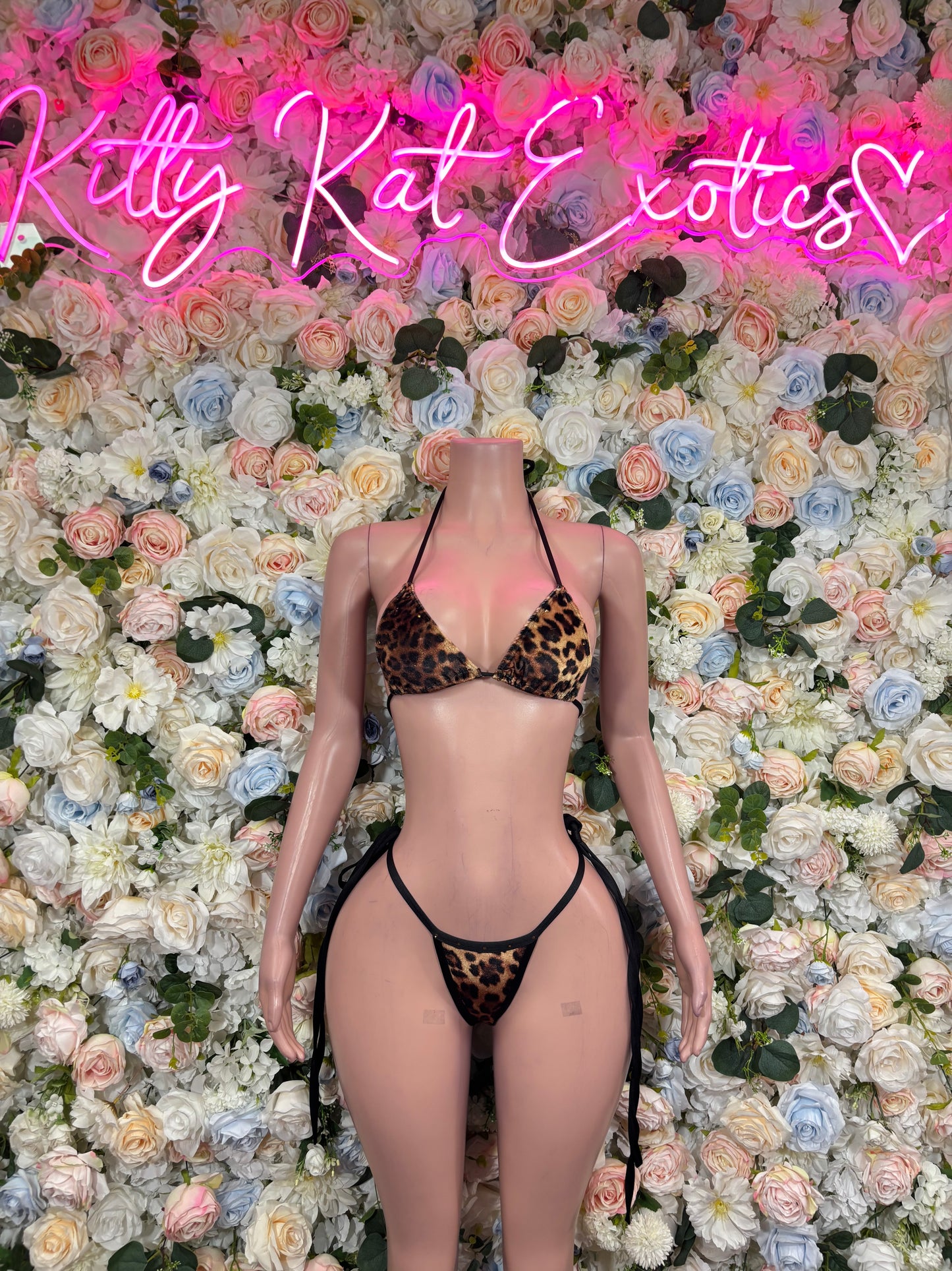 Cheetah-print two-piece rave set with triangle bikini top and thong-style bottoms