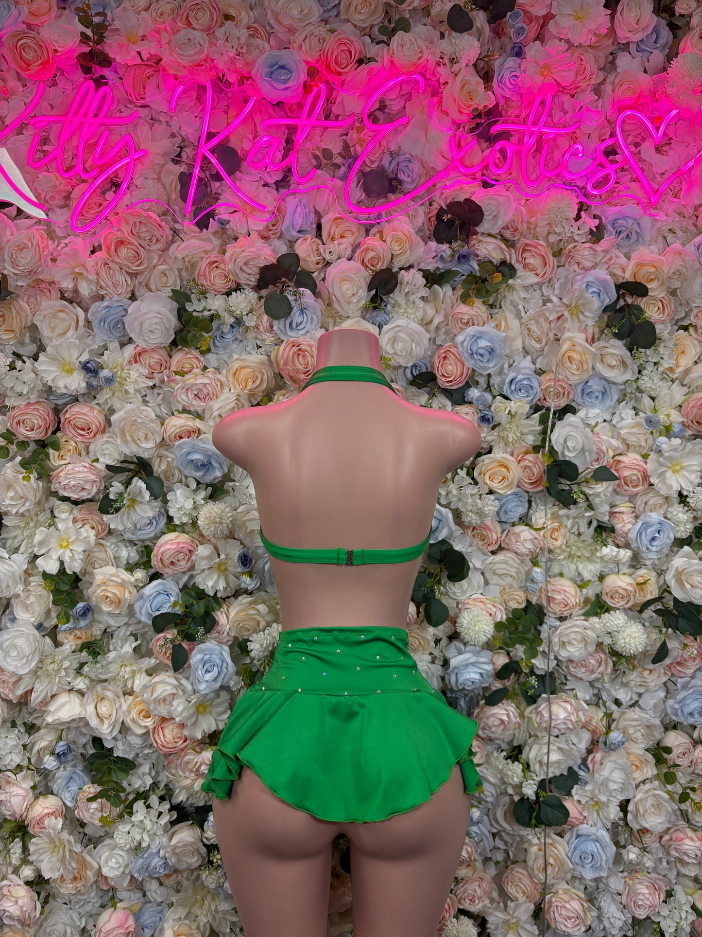 Green skirt set with strappy back and flared mini skirt, halter-style top