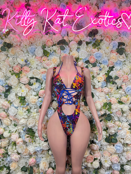Multicolor paint-splatter thong bodysuit with crisscross lace-up front and cheeky cutout