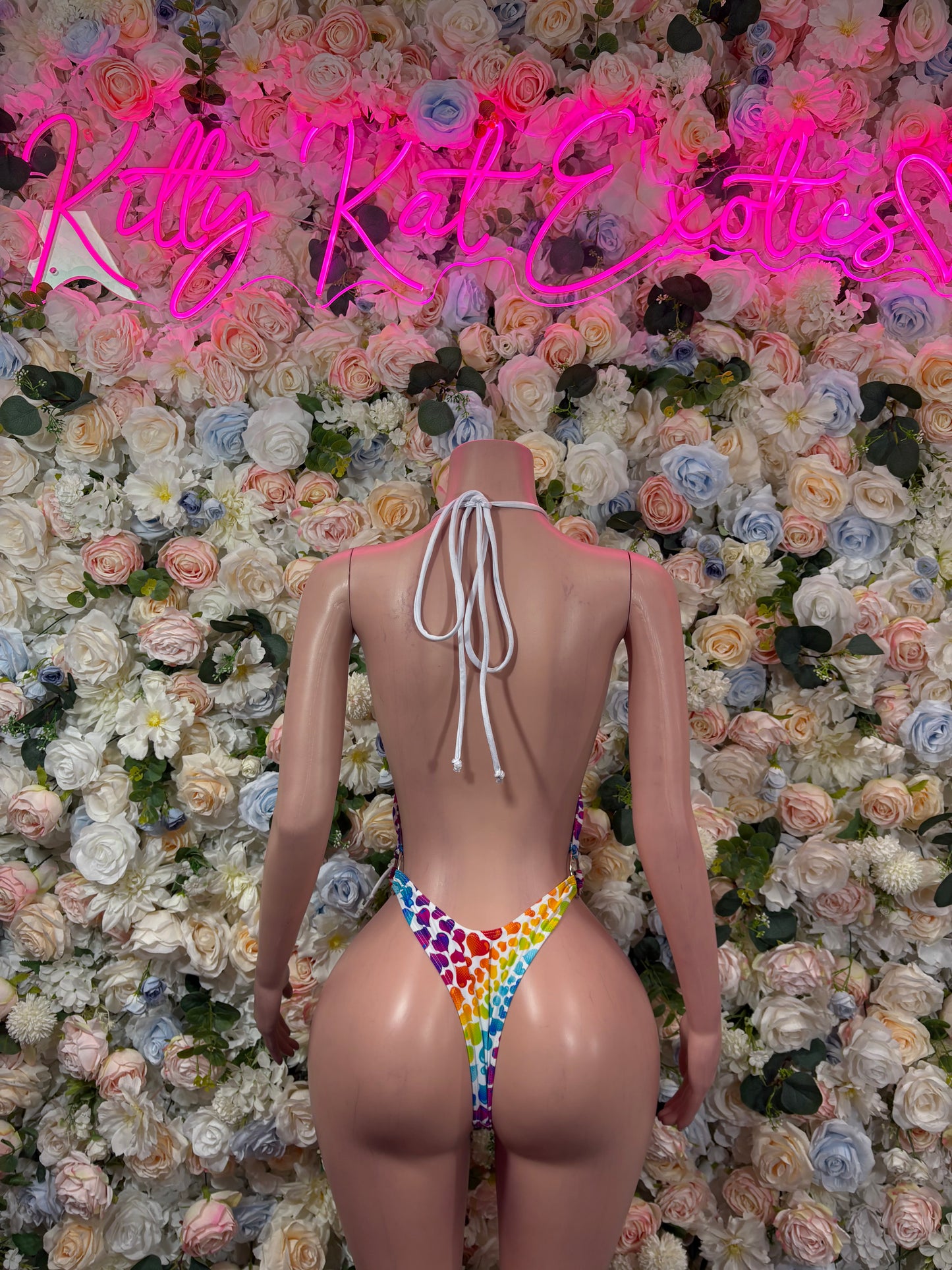 Back view: heart-pattern one-piece swimsuit with open back and long tie strings