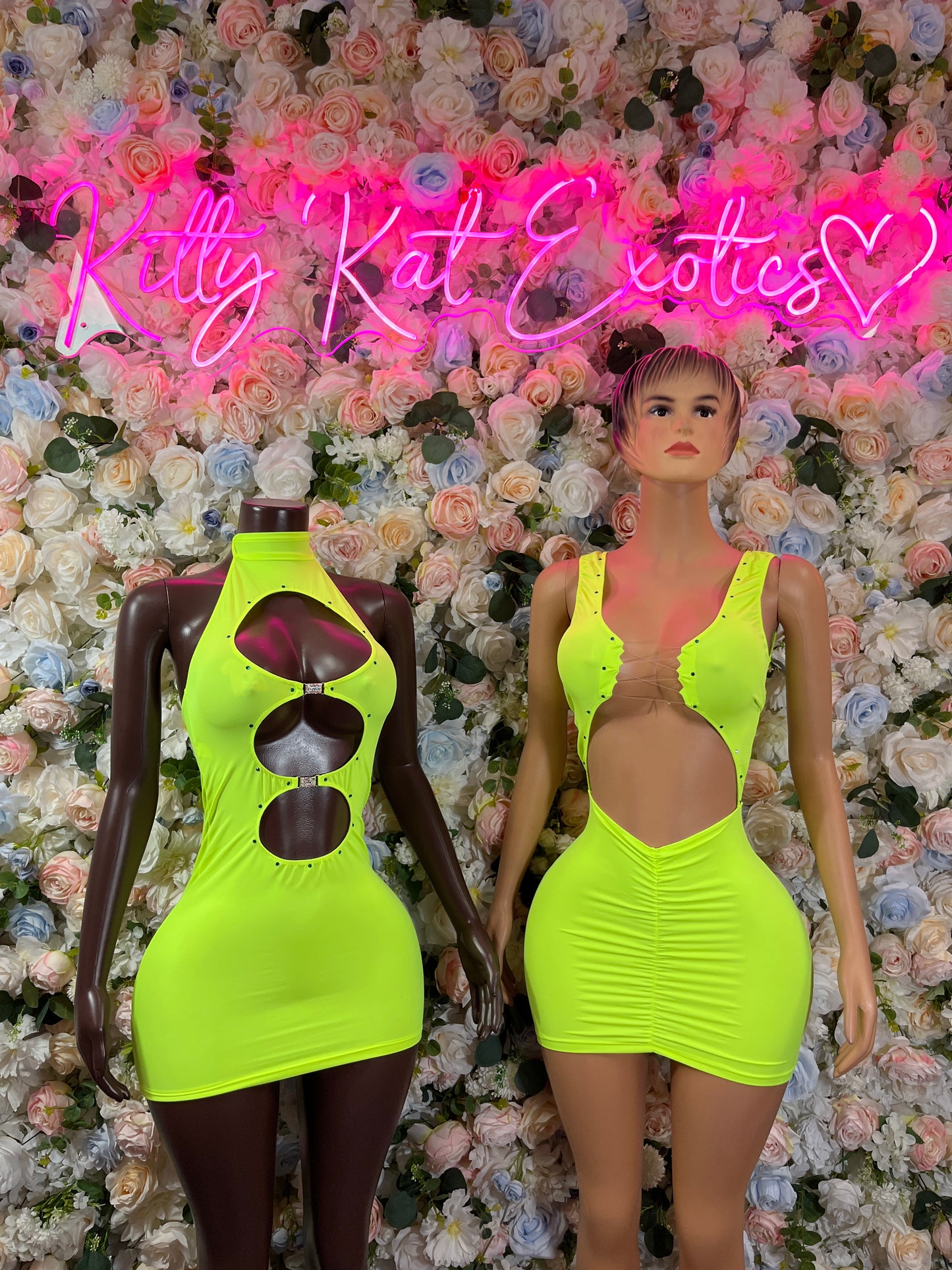 Neon green mini dress with halter straps and ruched front on model