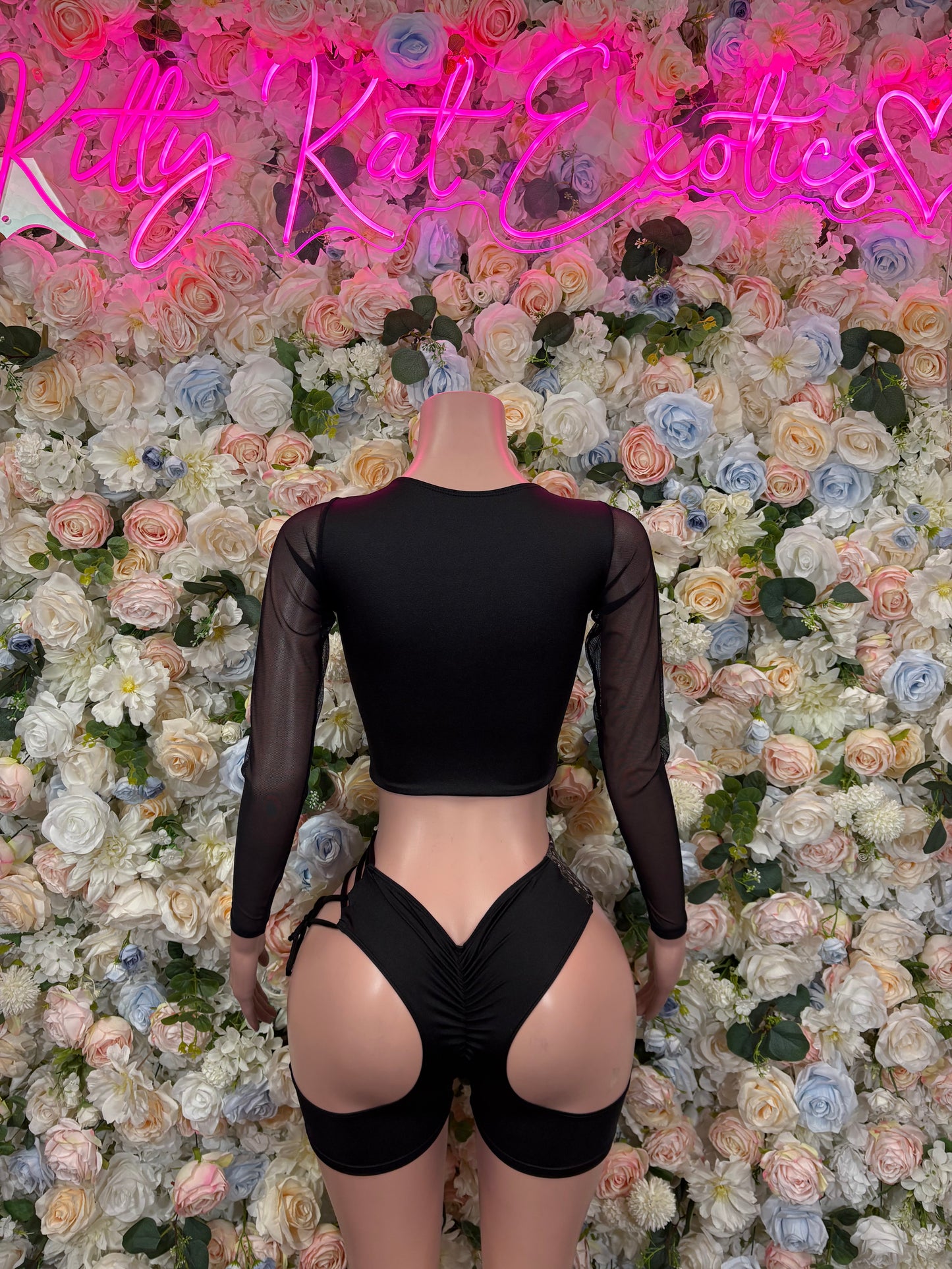 Black long-sleeve bodysuit with mesh sleeves and open back cutout, high-leg cut
