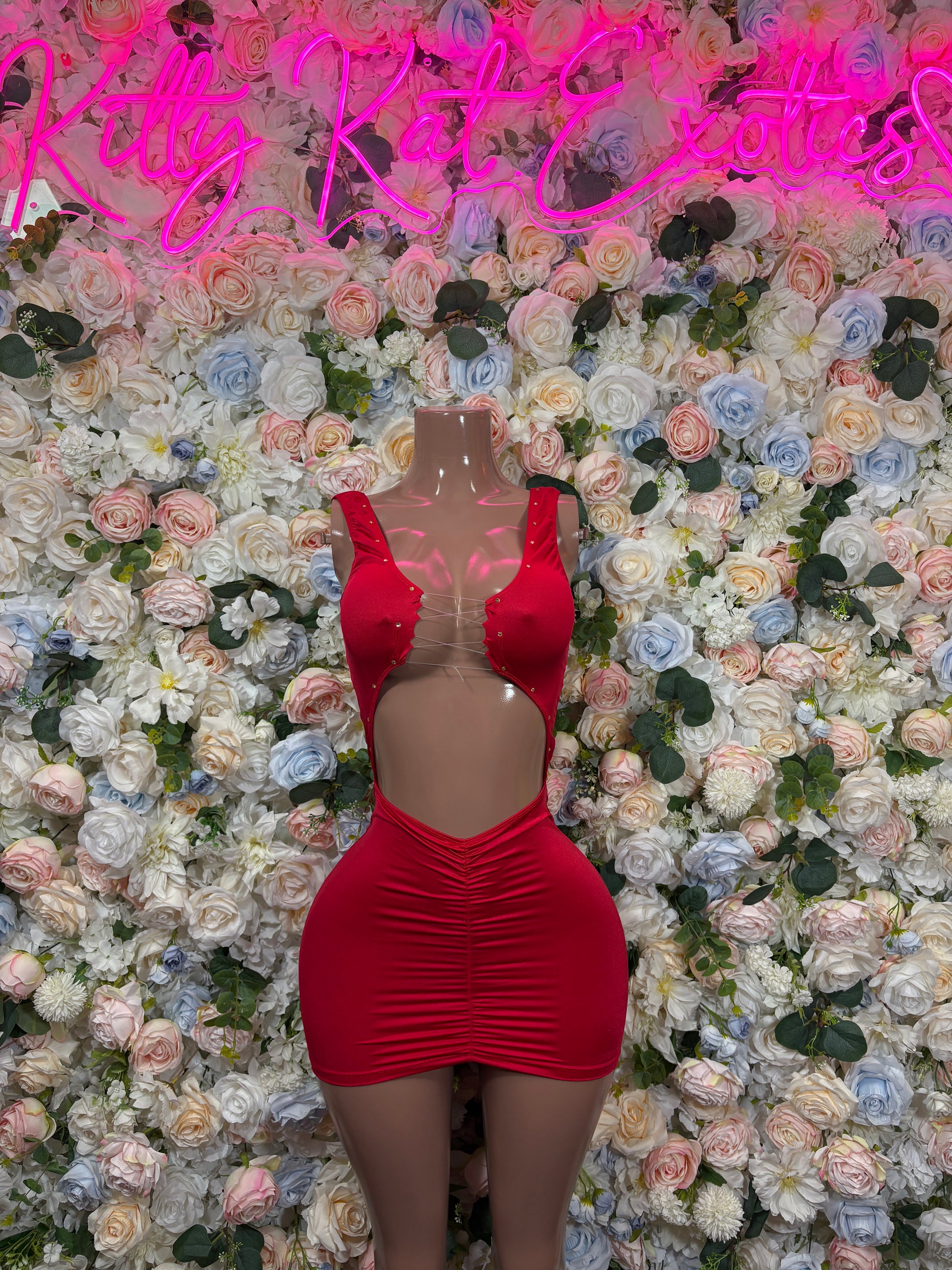 Red ruched bodycon mini dress with ruffled off-shoulder neckline