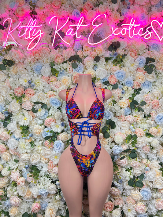 Front-view paint-splatter thong-style bodysuit with triangle top and lace-up waist