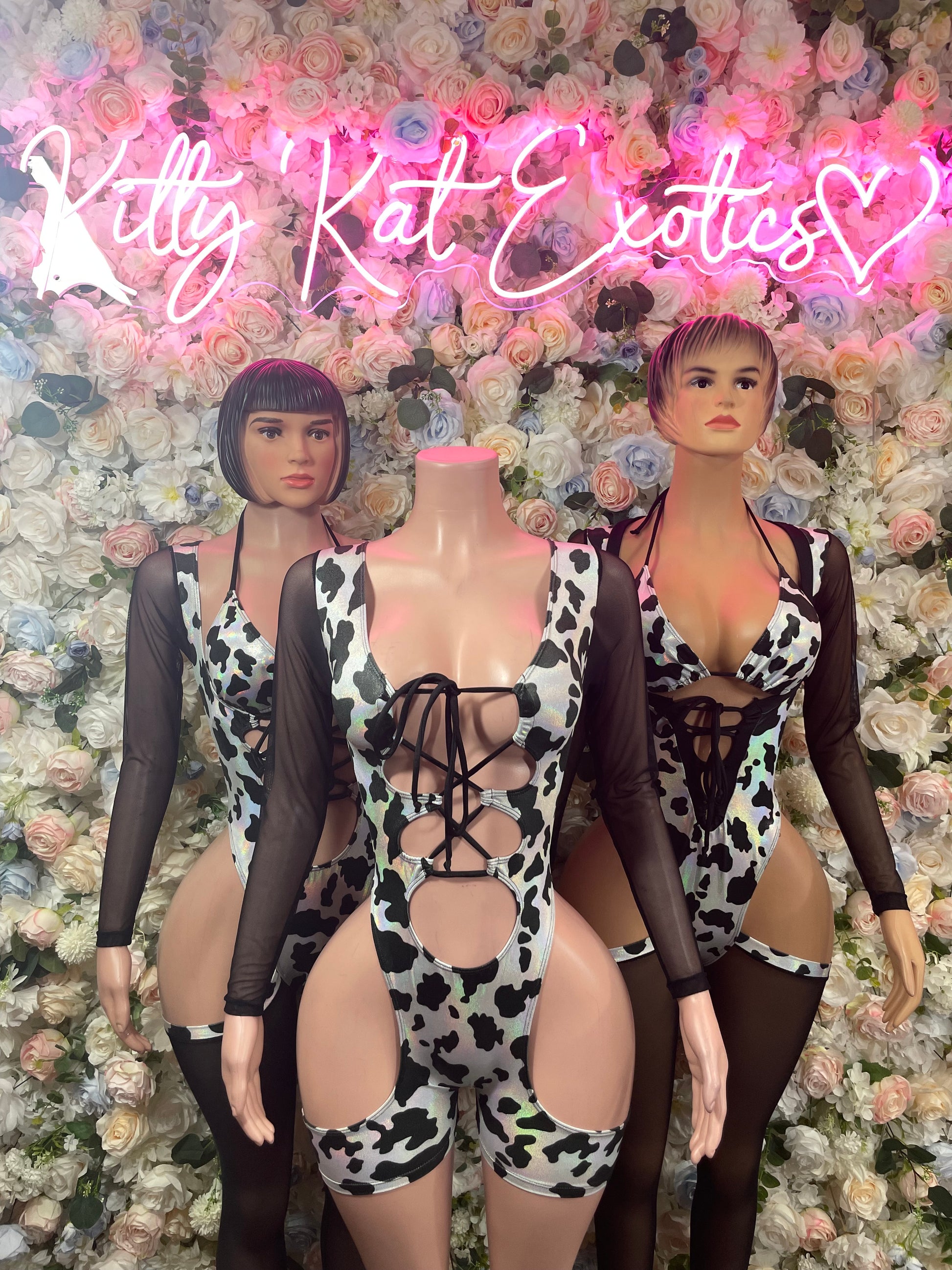 Cow print one-piece bodysuit with lace-up halter front, black mesh long sleeves