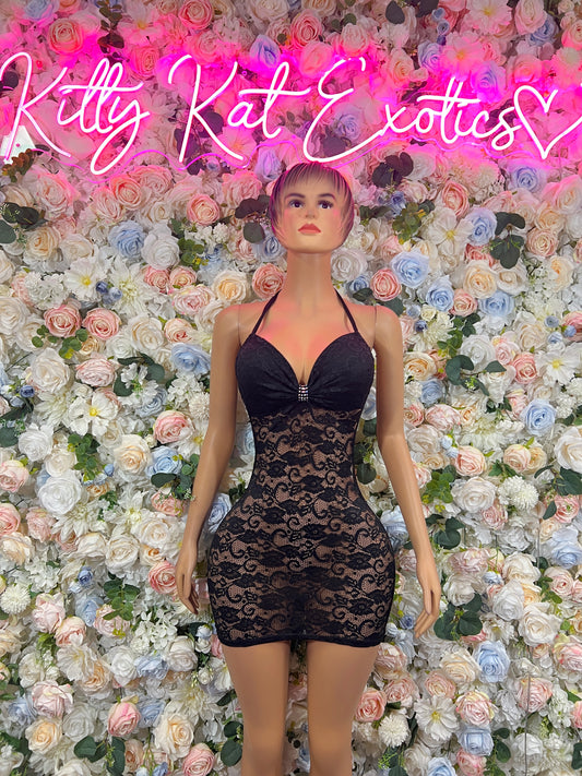 Black mini dress with sweetheart neckline, sheer lace panel and bow-tied front