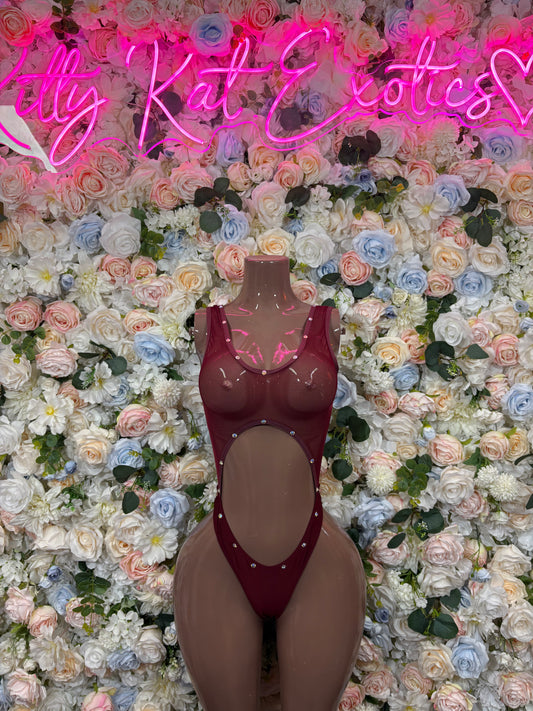 Burgundy sheer mesh bodysuit with oval cutout and rhinestone straps