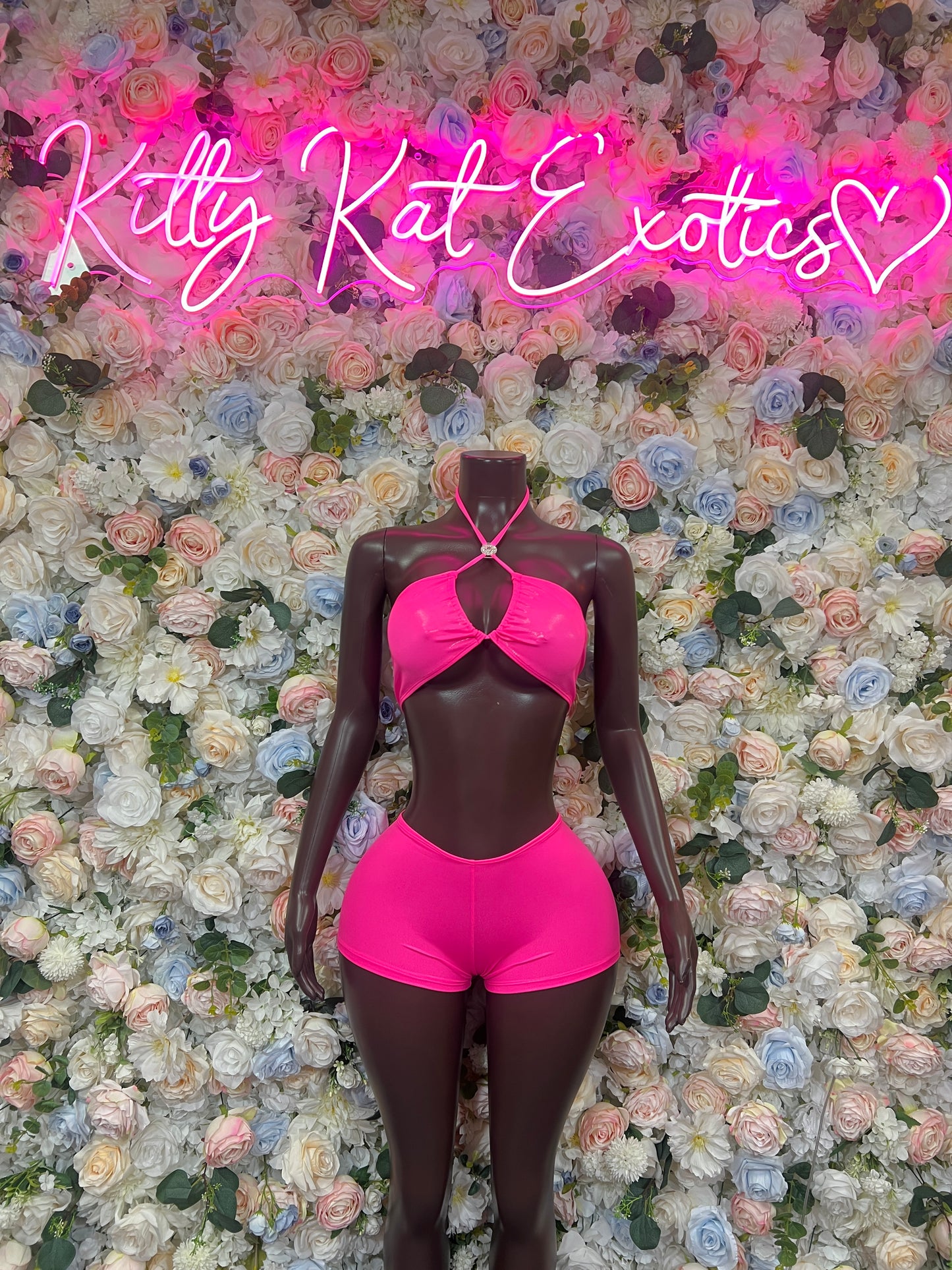 Hot pink metallic halter two-piece with front bow and high-rise shorts