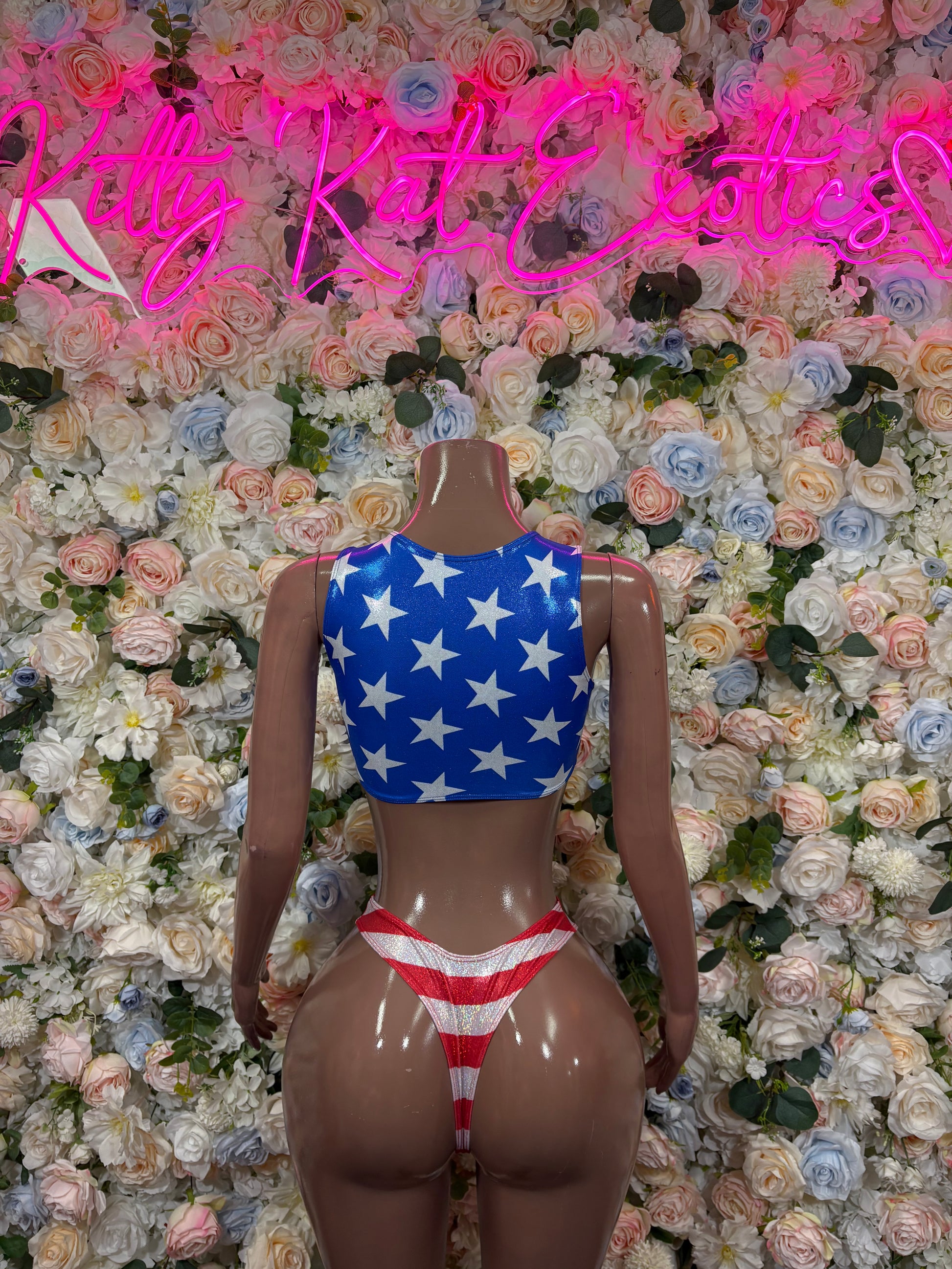 Patriotic two-piece swimsuit with blue star halter top and striped bikini bottoms