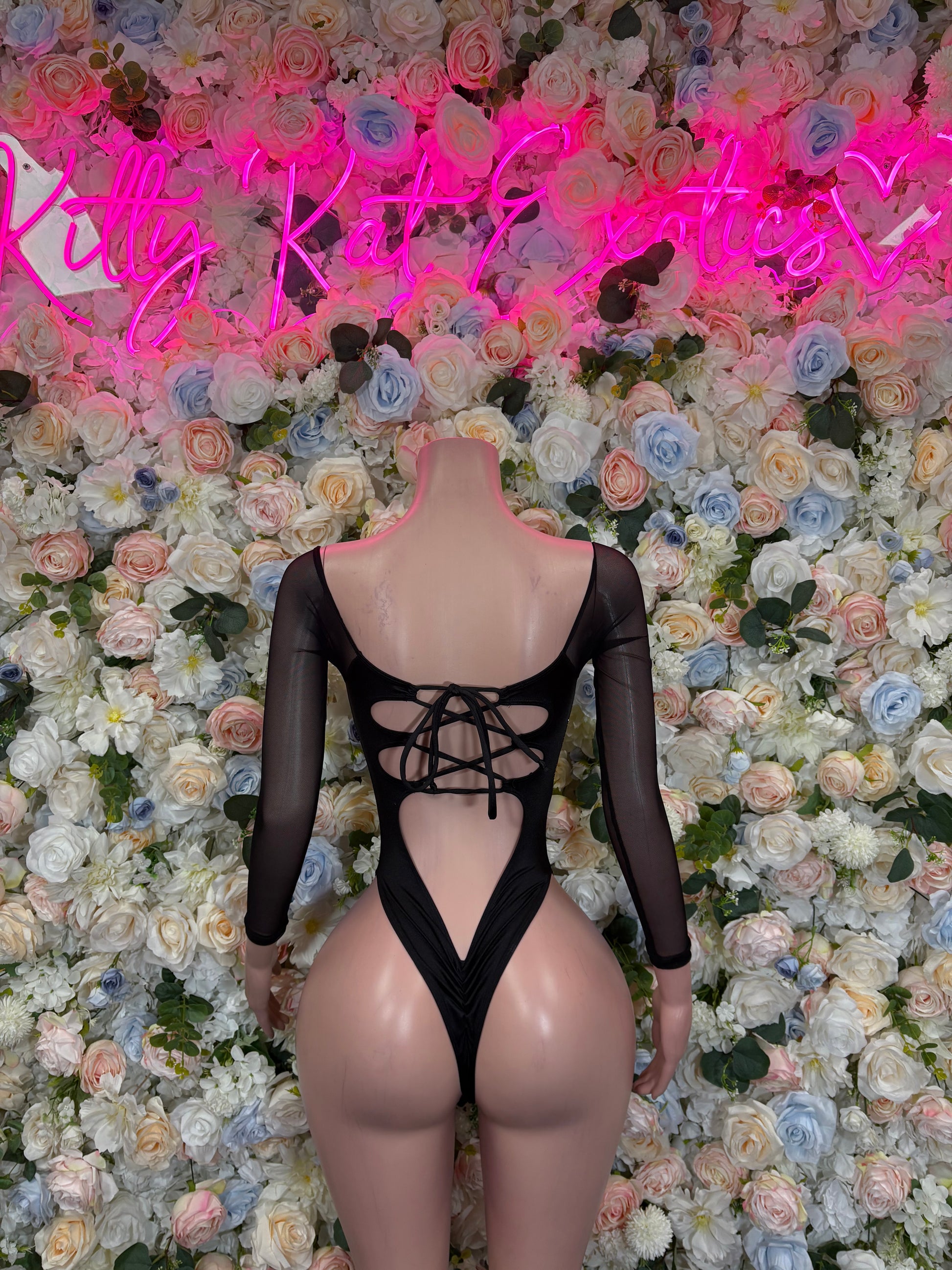 Women’s gold metallic bodysuit with black sleeves and crisscross lace-up back, thong