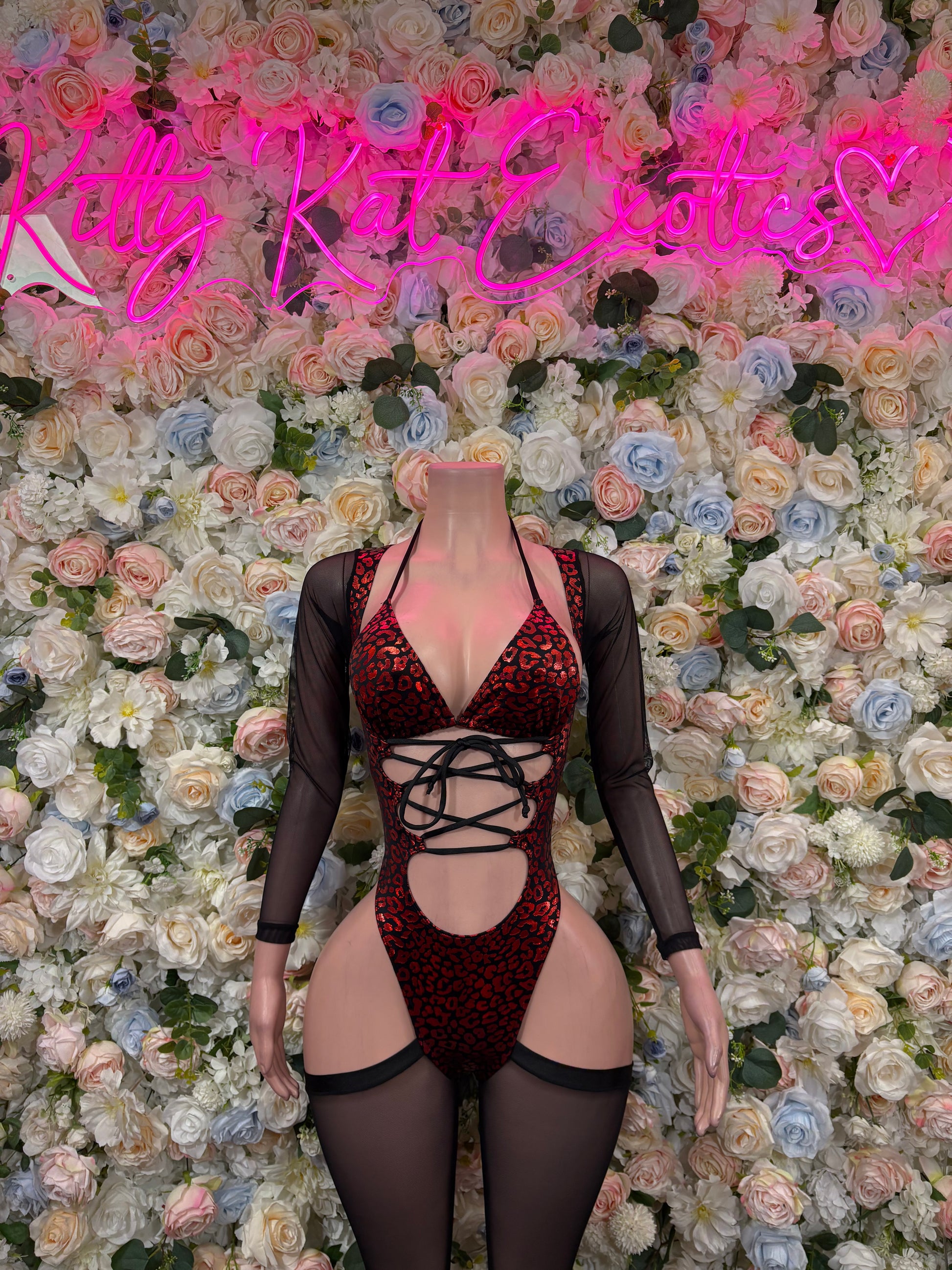 Red metallic cheetah-pattern bodysuit with crisscross lace front, sheer black sleeves