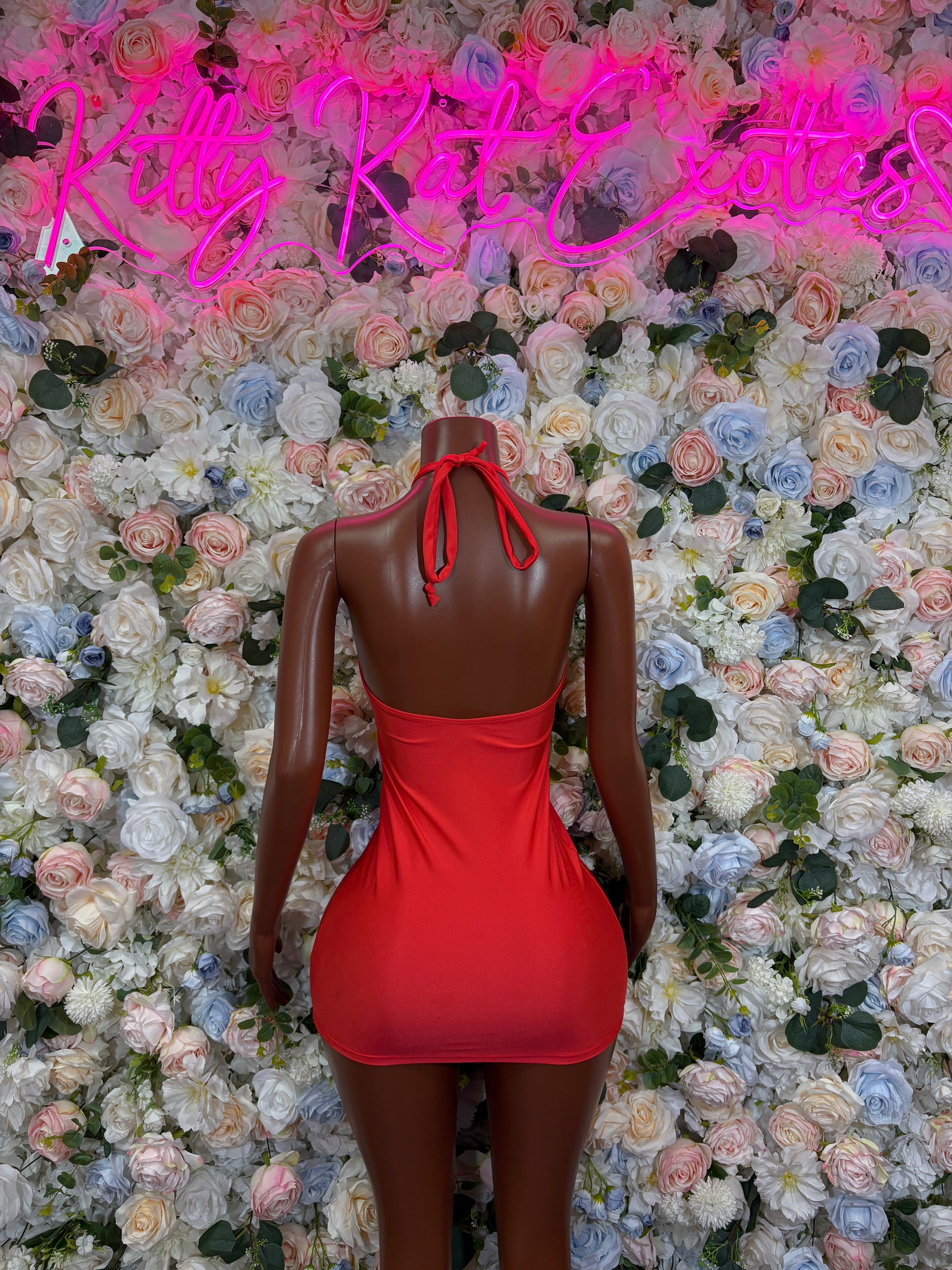 Red backless halter bodycon mini dress with crisscross tie detail on back