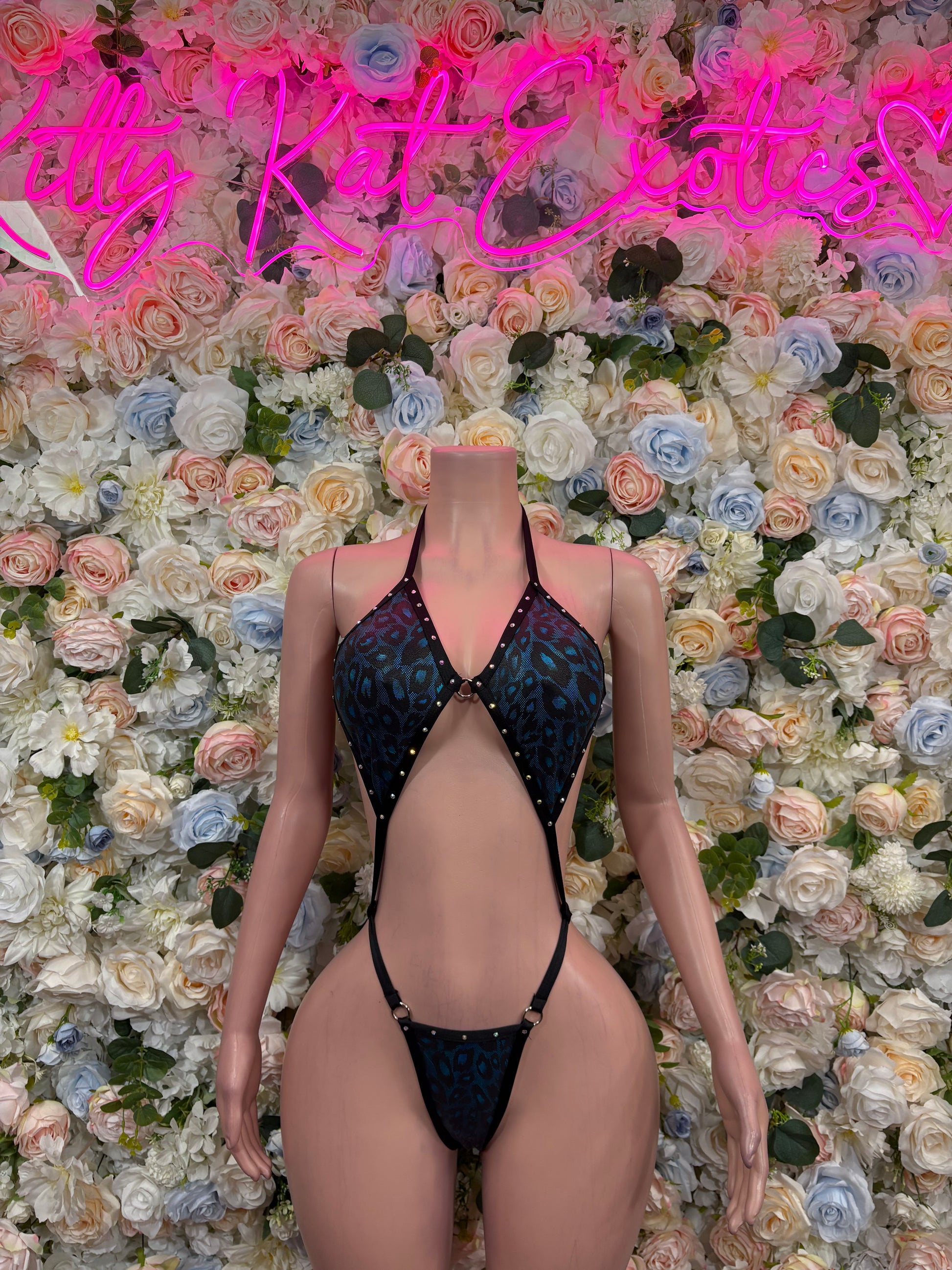 Blue cheetah one-piece dancewear with V-neck cutout and tie-back straps, front view