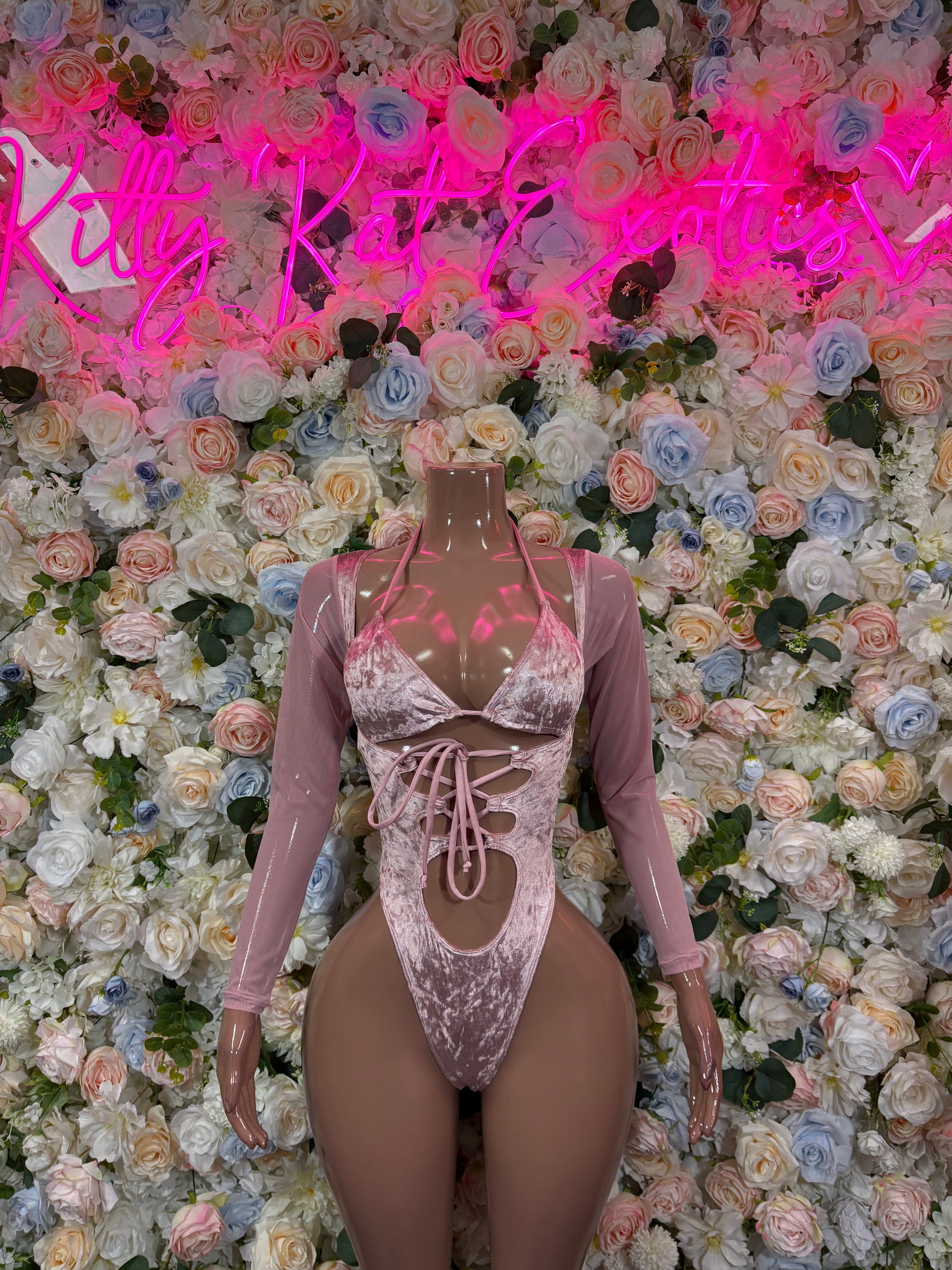 Rose pink velvet bodysuit with long sleeves, lace-up front, strappy back, thong cut
