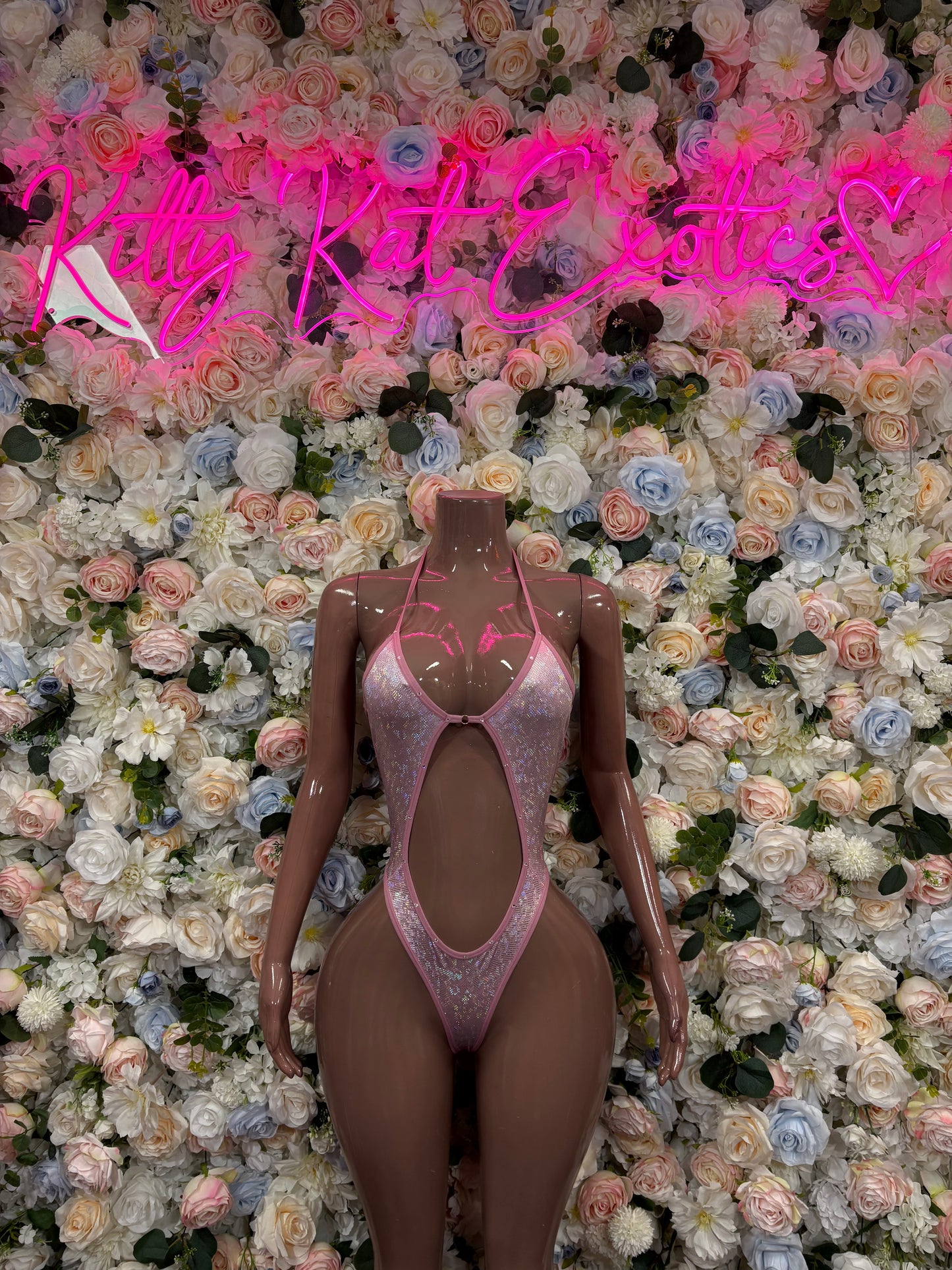 Pink rhinestone mesh bodysuit with high-cut leg and keyhole front