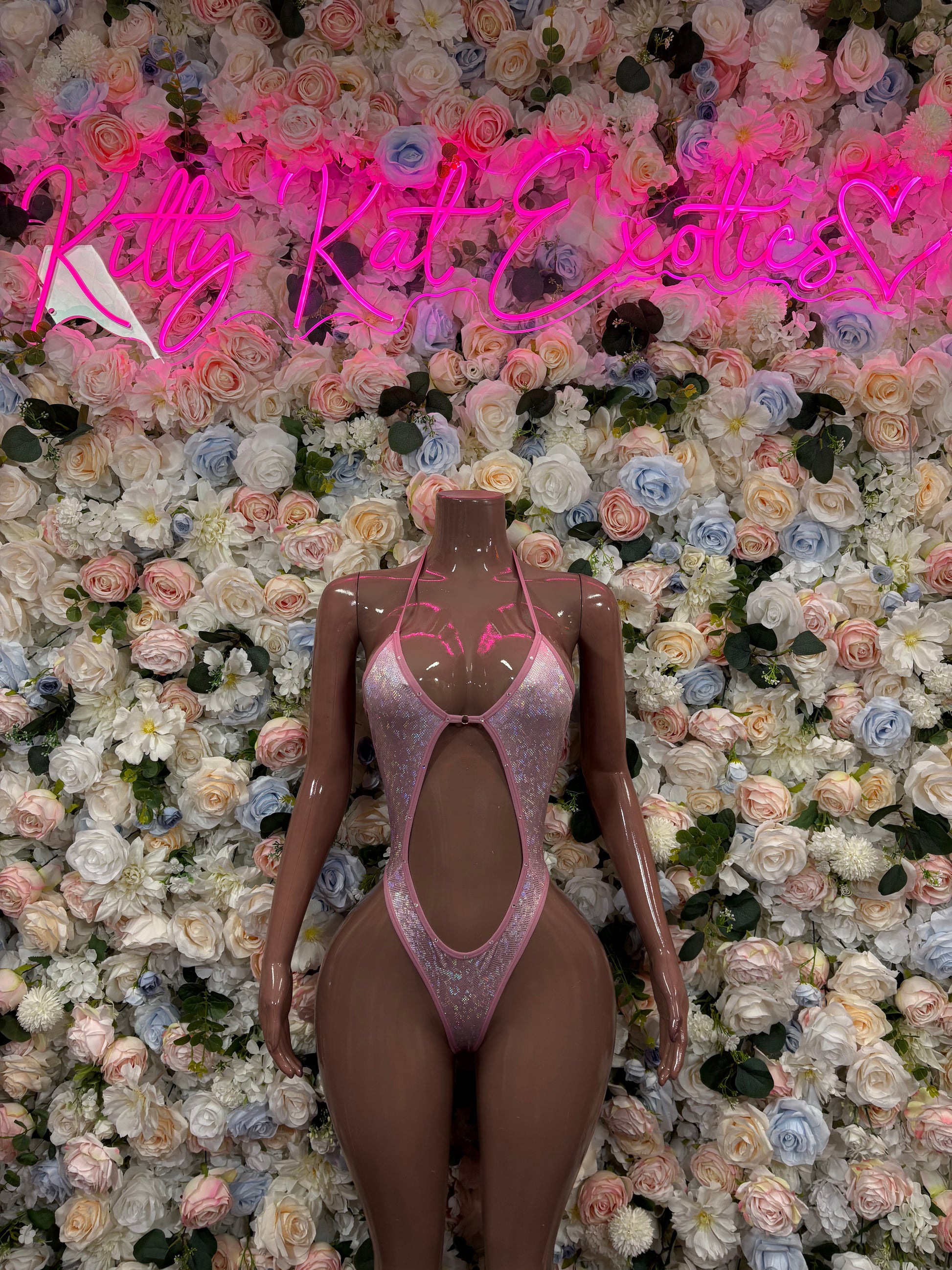 Pink rhinestone mesh bodysuit with high-cut leg and keyhole front