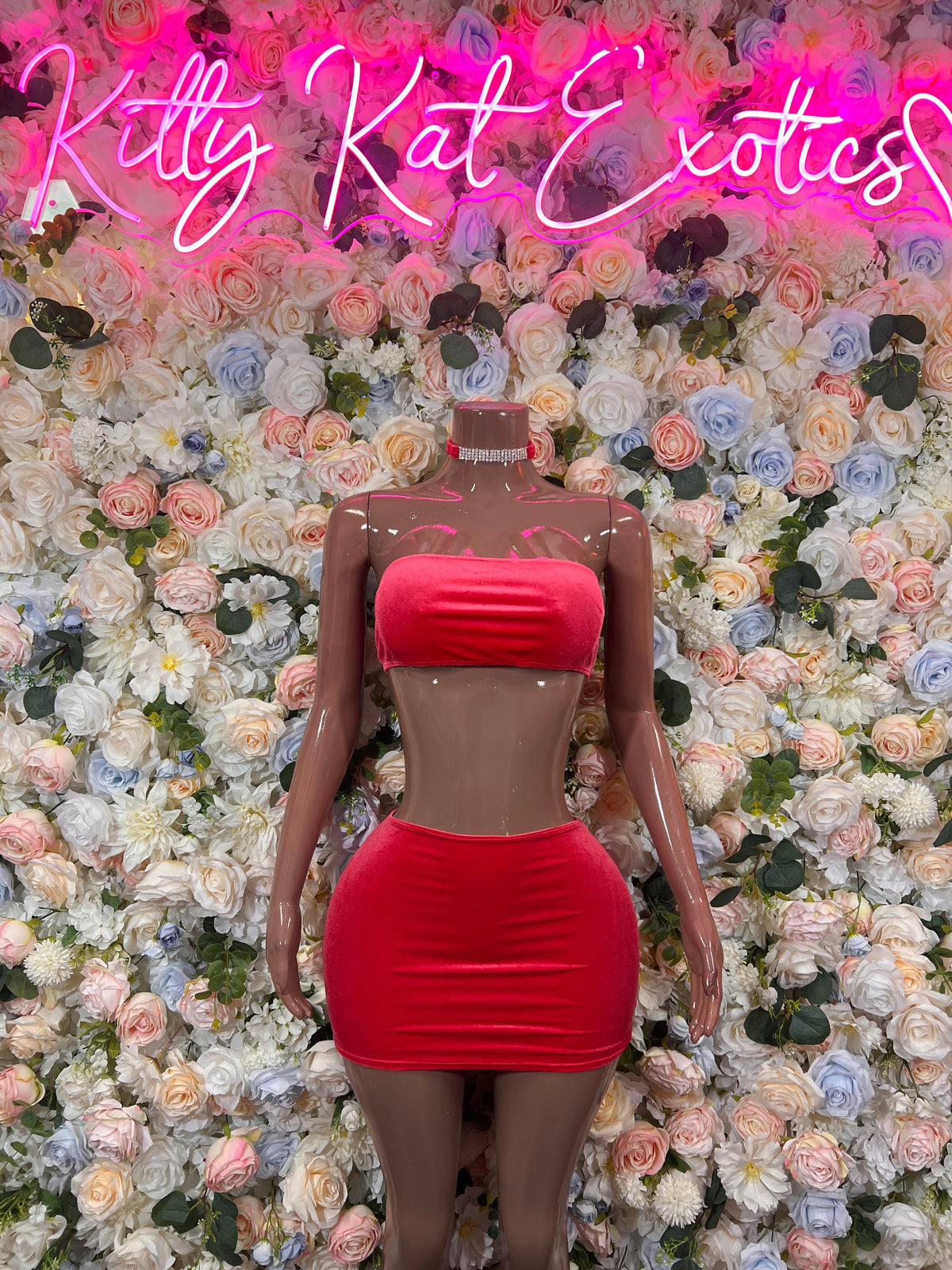 Coral two-piece rave outfit: strapless bandeau top and high-waist mini skirt, front view