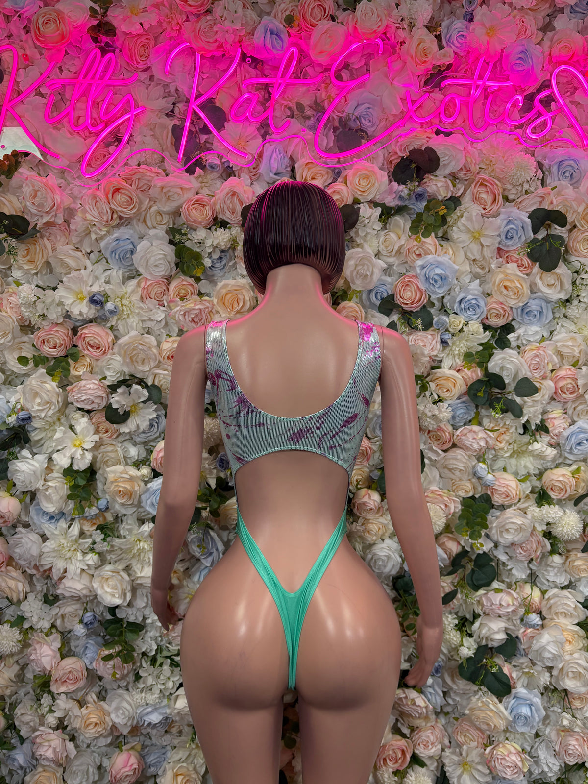 Green metallic bodysuit with thin straps and open back, high-cut thong