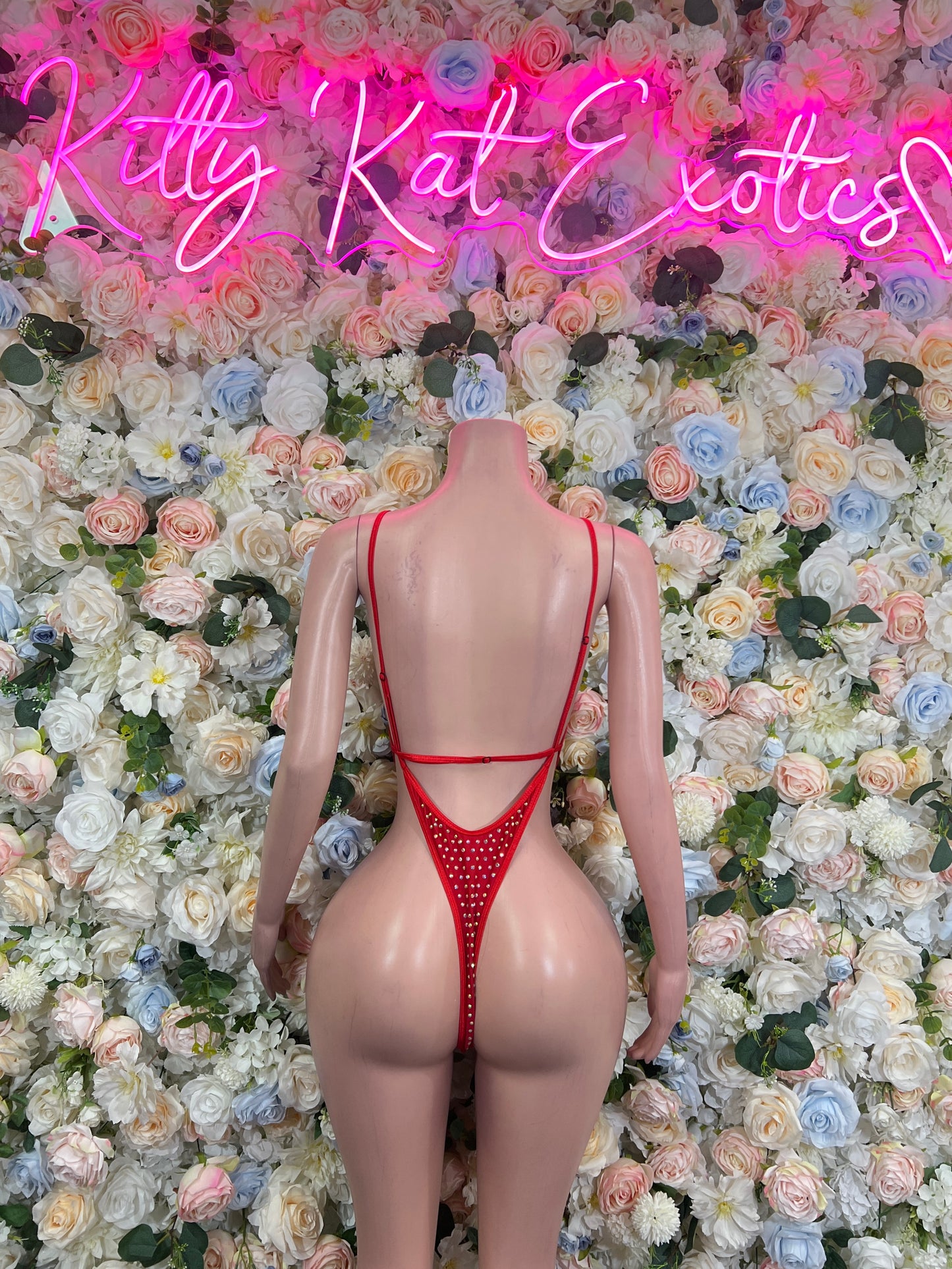 Red rhinestone bodysuit with open back and thin crisscross shoulder straps