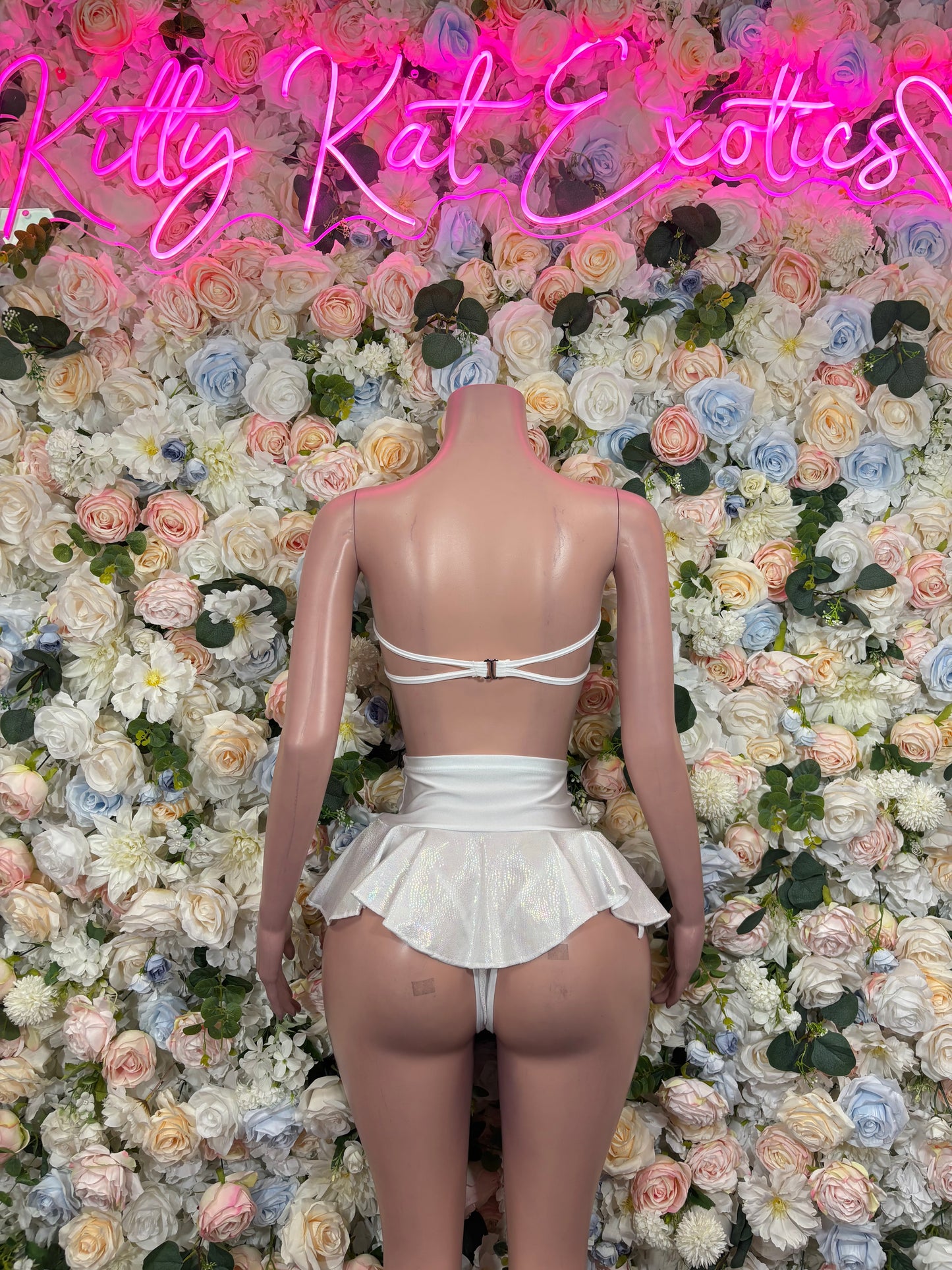 White halter crop top with tie-back straps and ruffled mini skirt set