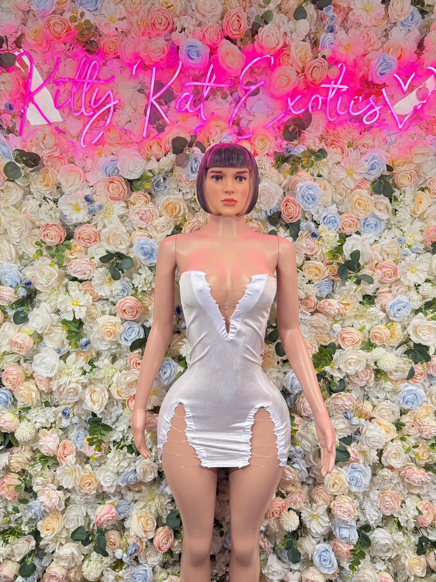 White metallic strapless mini dress with sweetheart neckline and ruched ruffle hem