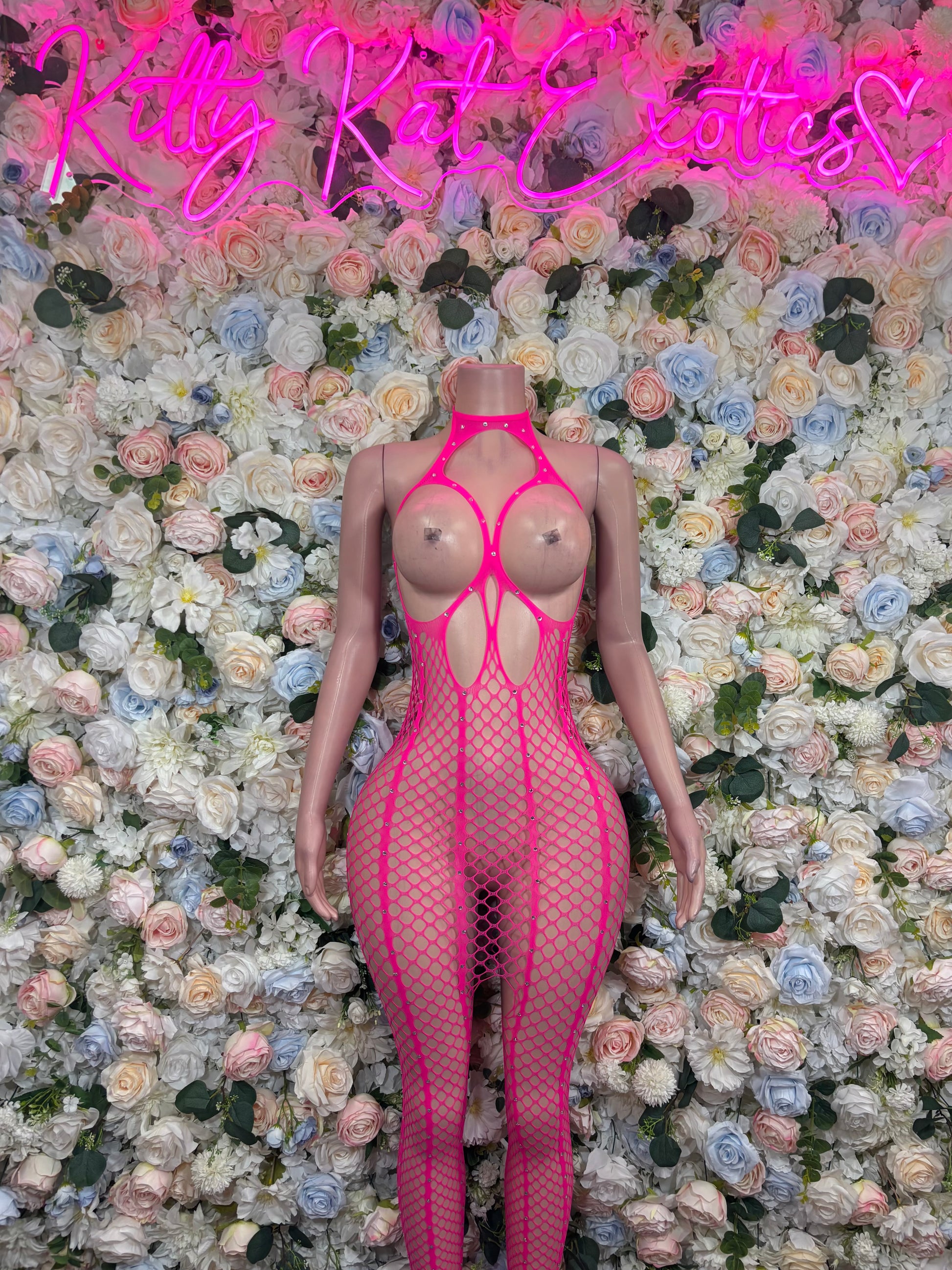 Hot pink fishnet bodysuit with high-cut open-back and crisscross straps