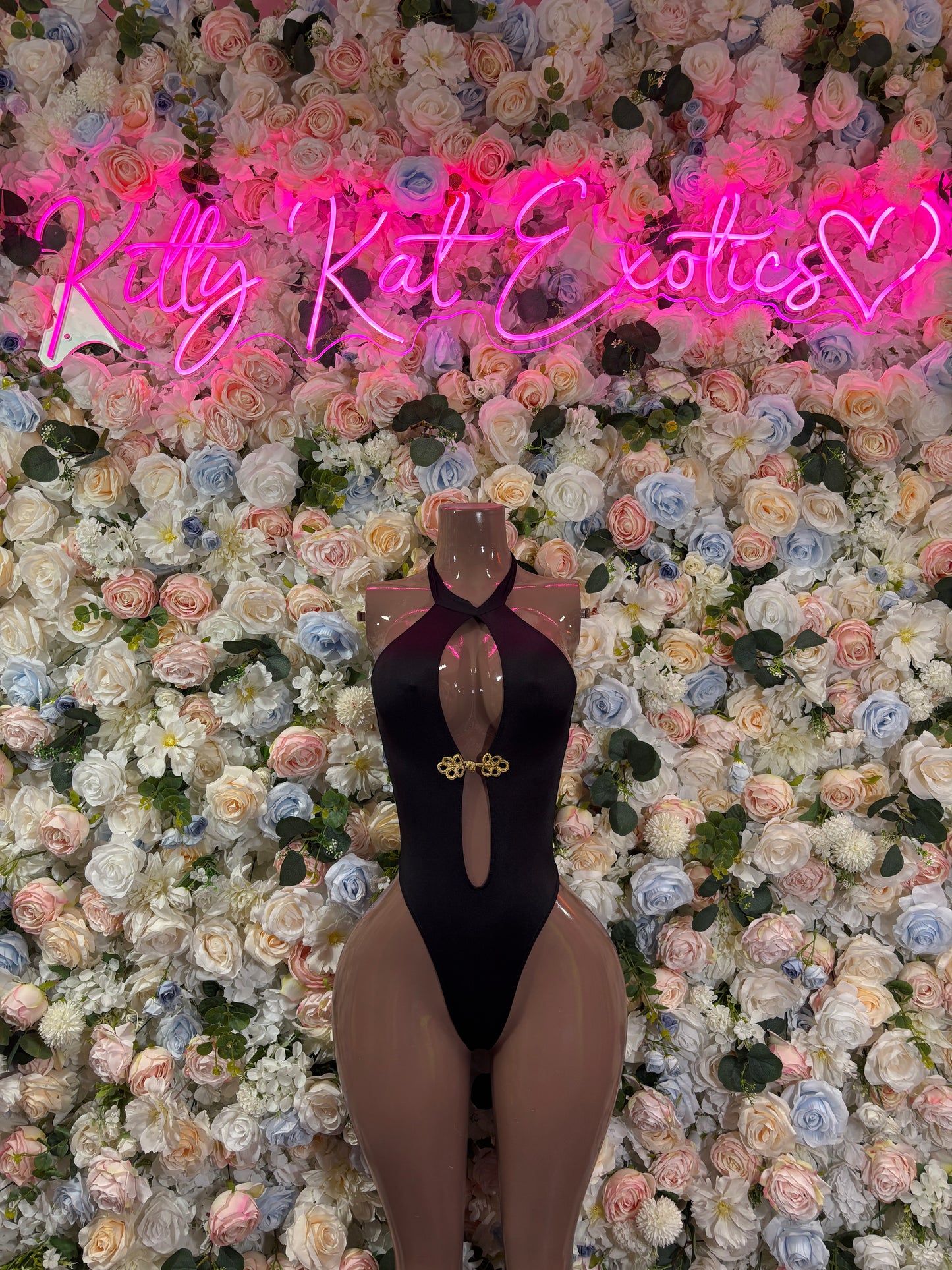 Black one-piece cutout bodysuit with halter neck and front keyhole
