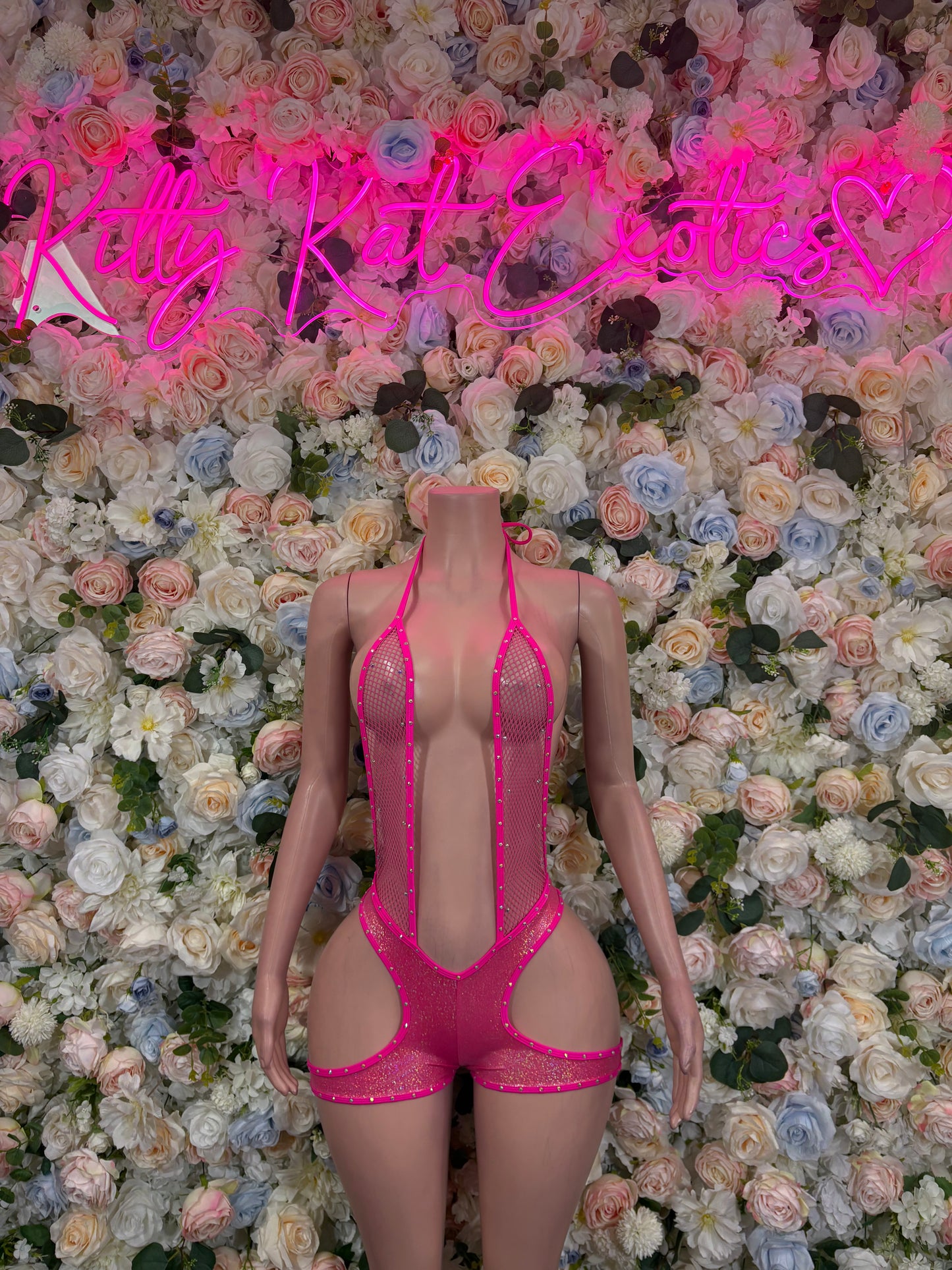 Pink strappy bodysuit with vertical rhinestone pattern, open back and thong fit