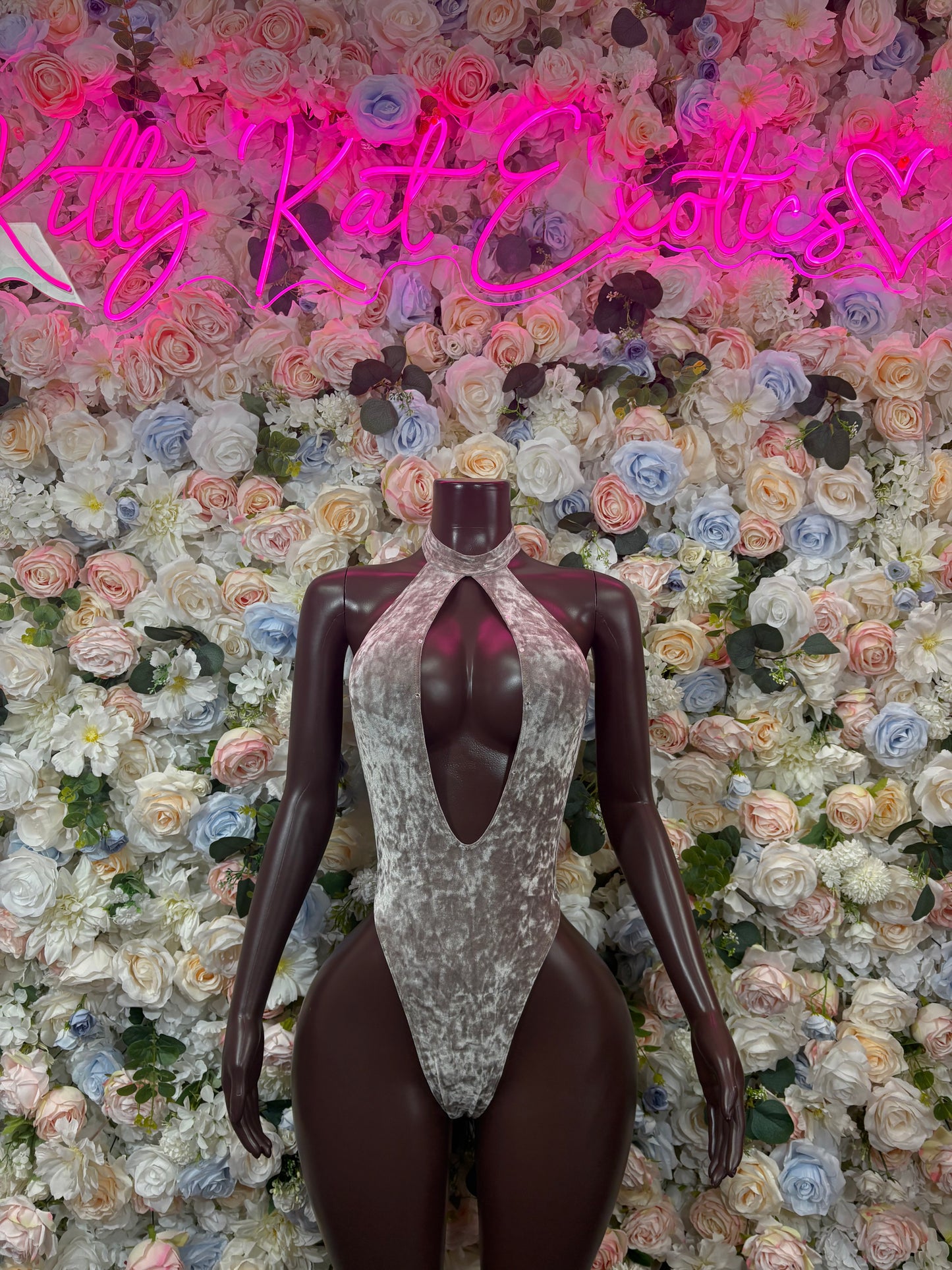 Metallic silver velvet bodysuit with keyhole neckline and high-cut backless design