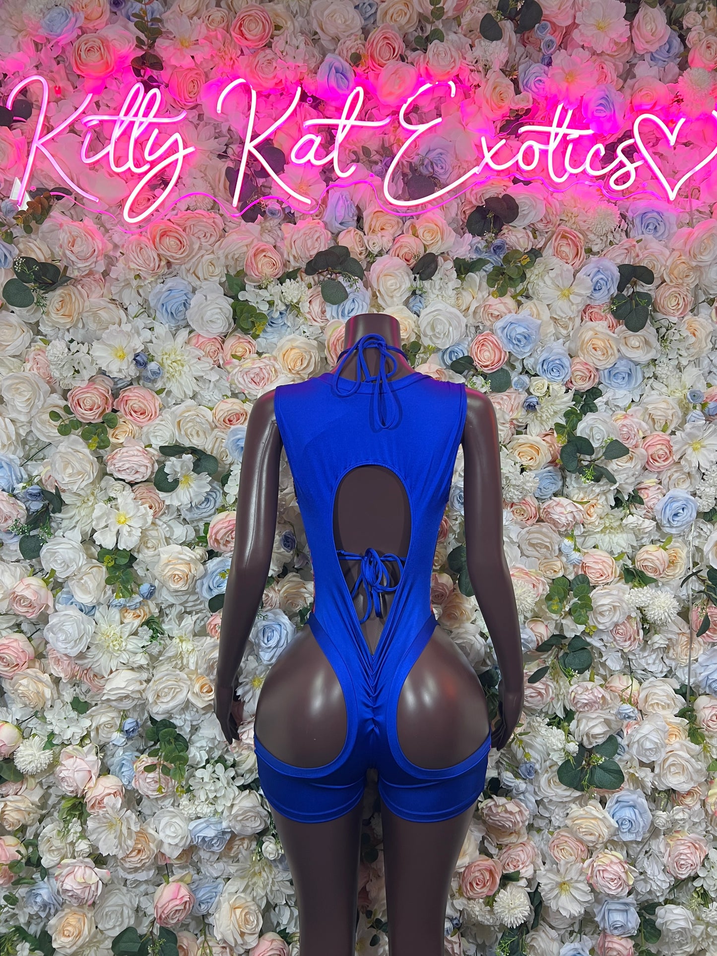 Blue paint-splatter bodysuit with crisscross lace-up front and high cut legs