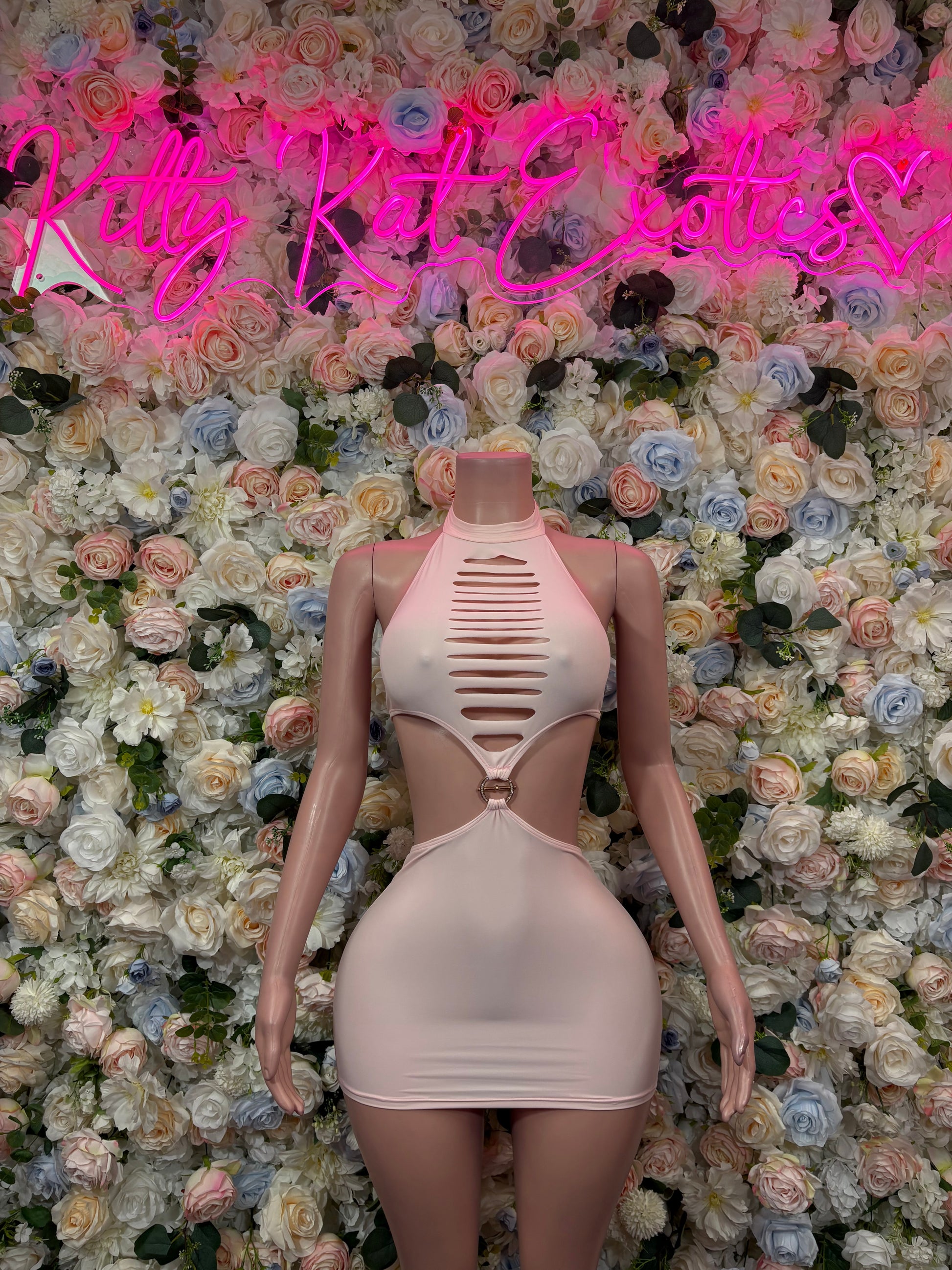 Light pink sleeveless mini dress with halter neckline and striped cutout front
