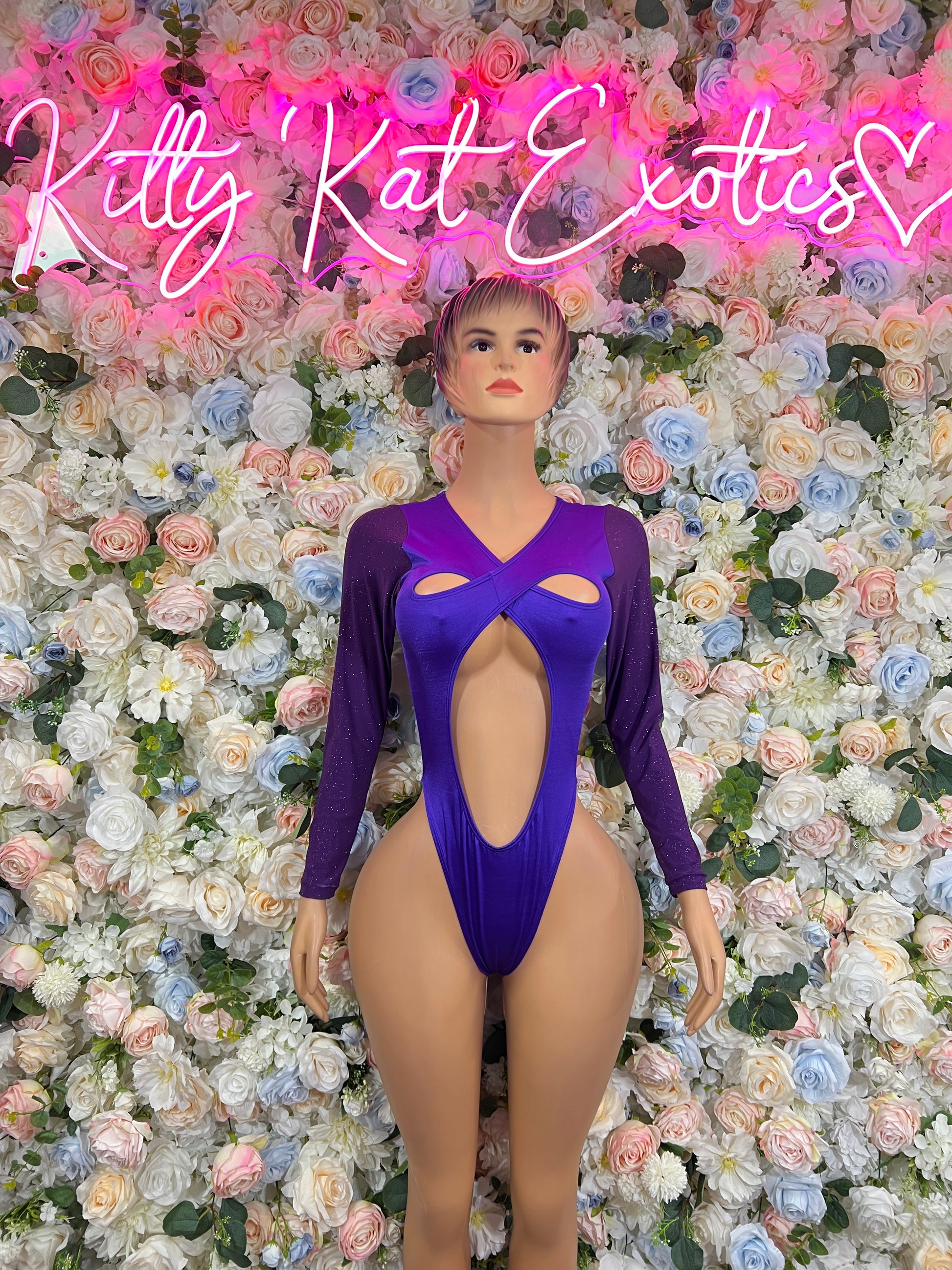 Purple long-sleeve cutout bodysuit with crisscross neckline and open back