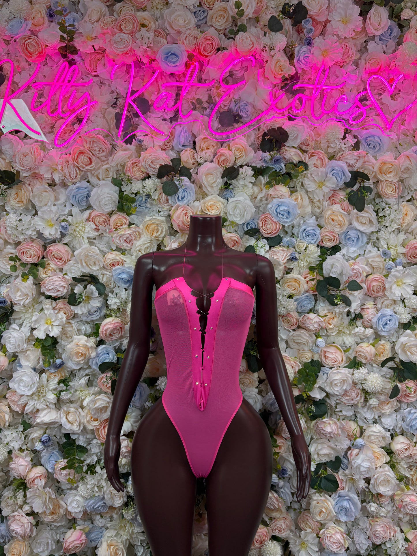 Rave bodysuit with hot pink front and dark long sleeves
