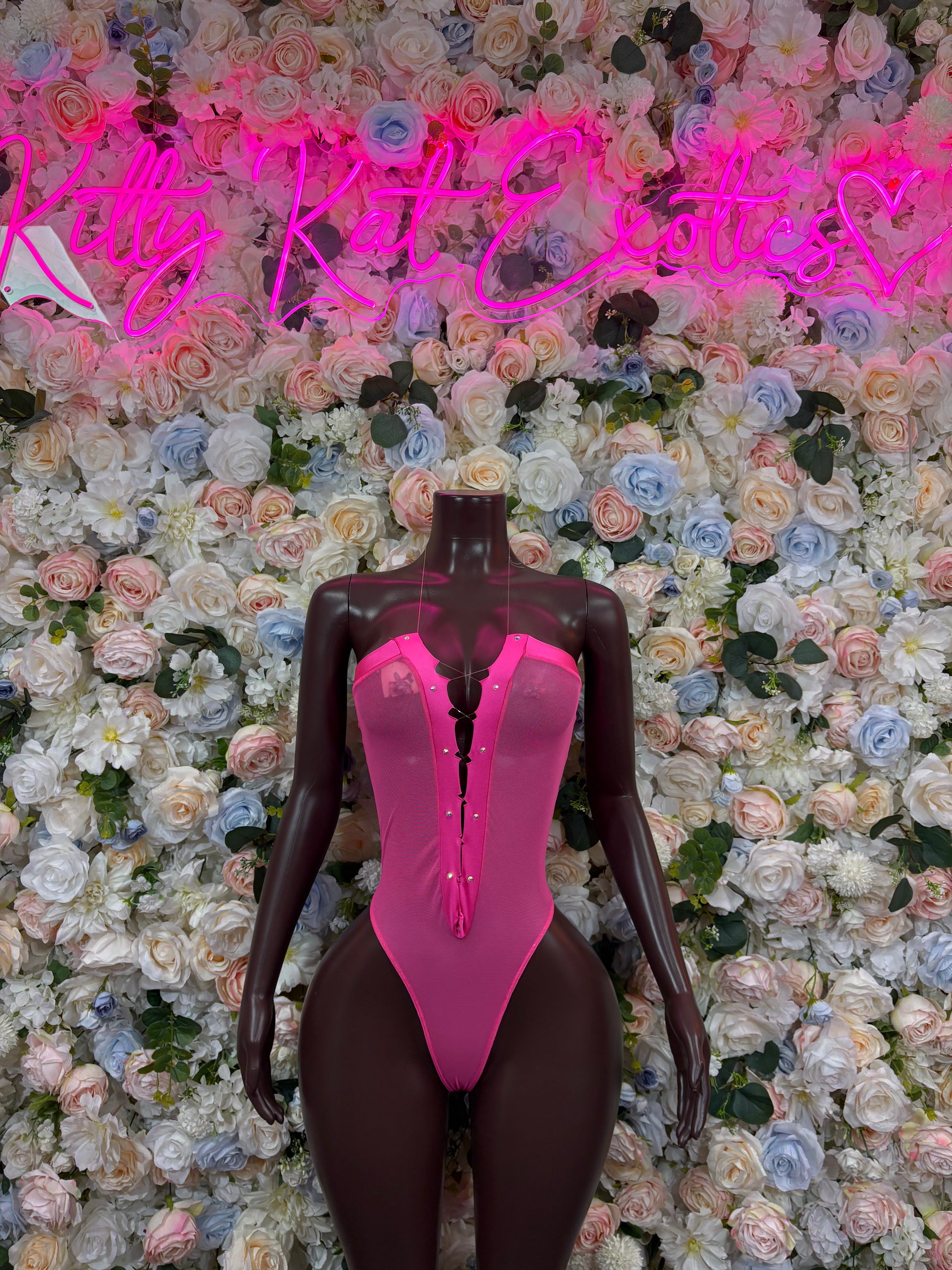 Rave bodysuit with hot pink front and dark long sleeves
