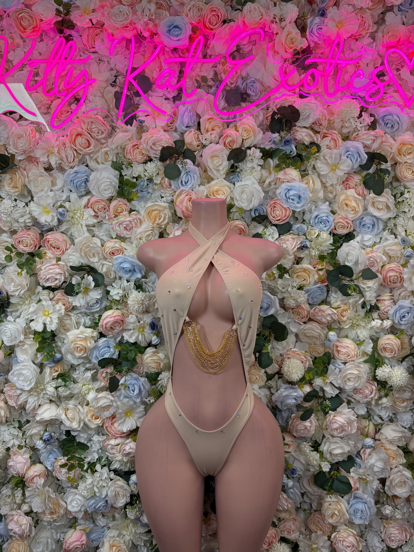 Nude cross-back bodysuit with high-cut legs and thong front, gold chain detail