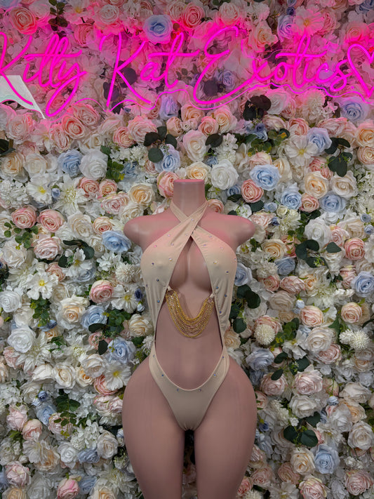 Nude cross-back bodysuit with high-cut legs and thong front, gold chain detail