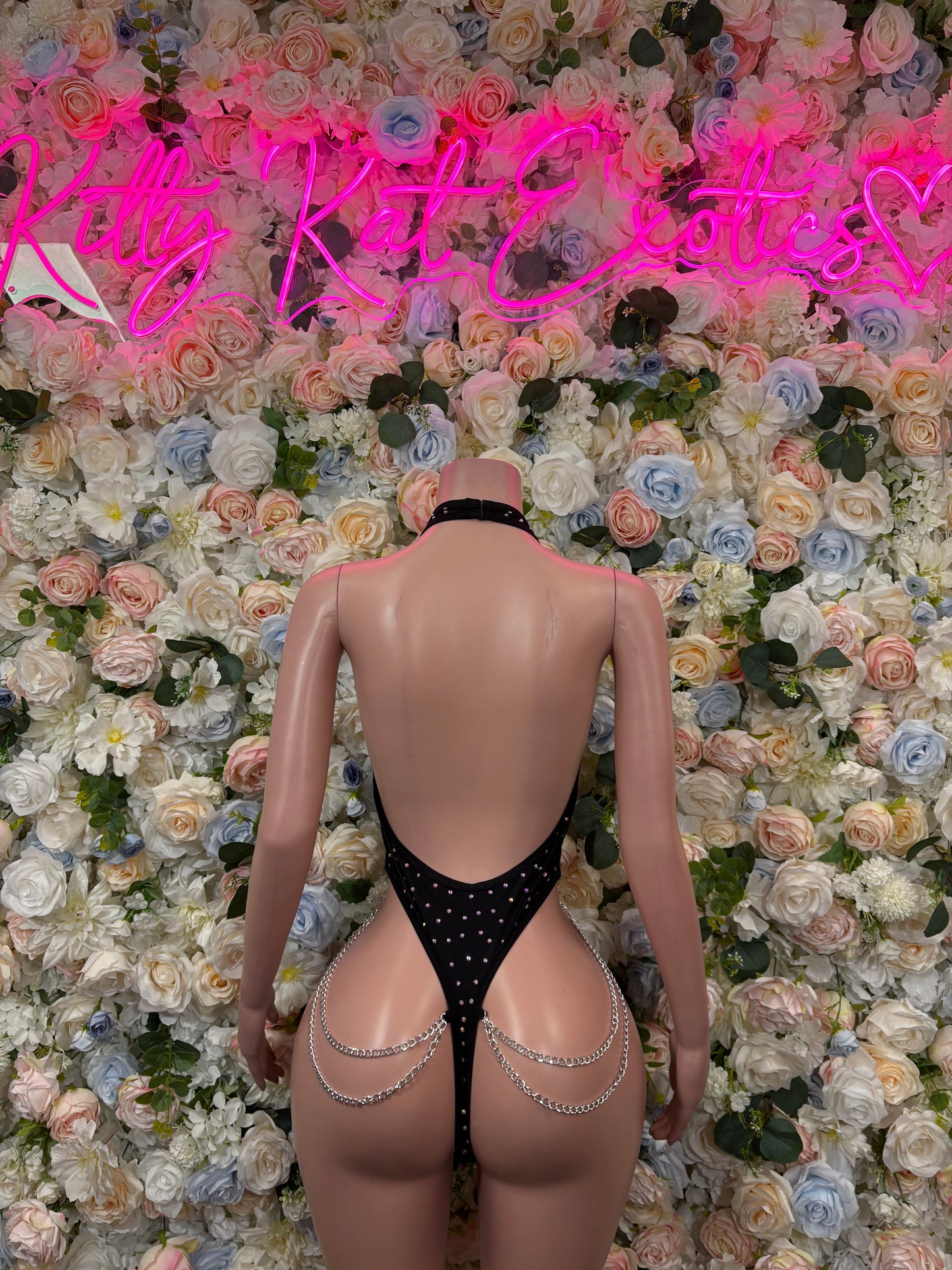 Black fishnet chainlink rhinestone bodysuit, open back with V-shaped bottom