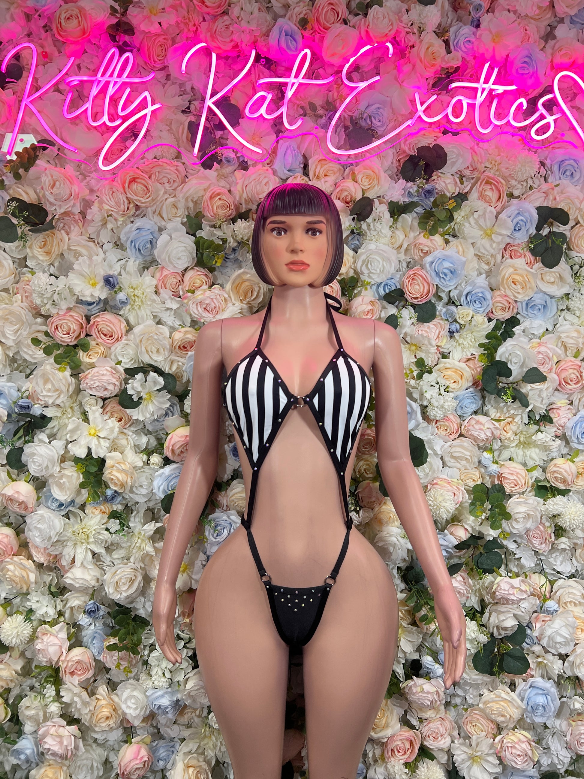 Black-and-white striped halter bodysuit with lace-up front and thong bottom