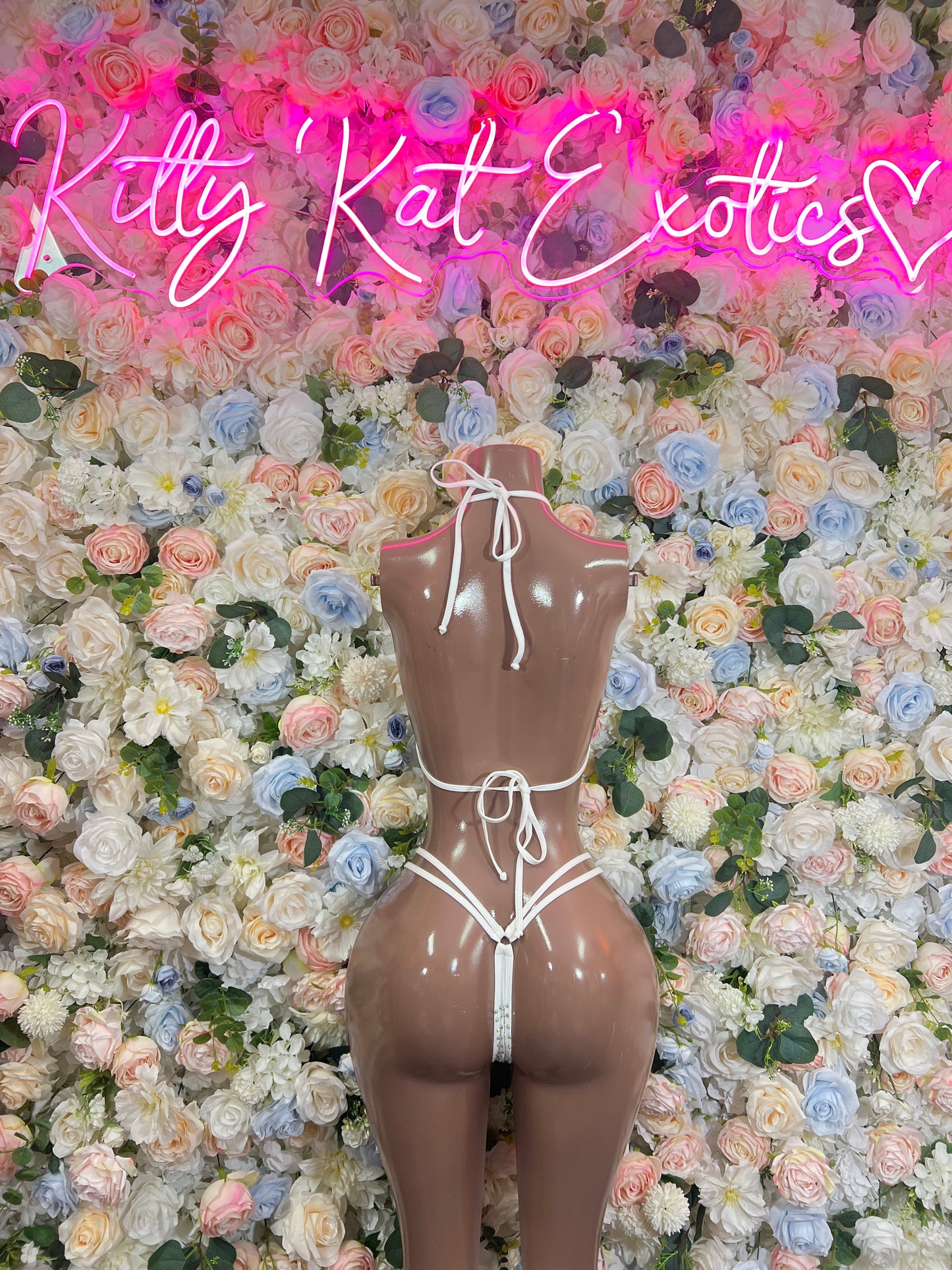 White rhinestone bikini set on mannequin, triangle bikini top and string bikini bottoms