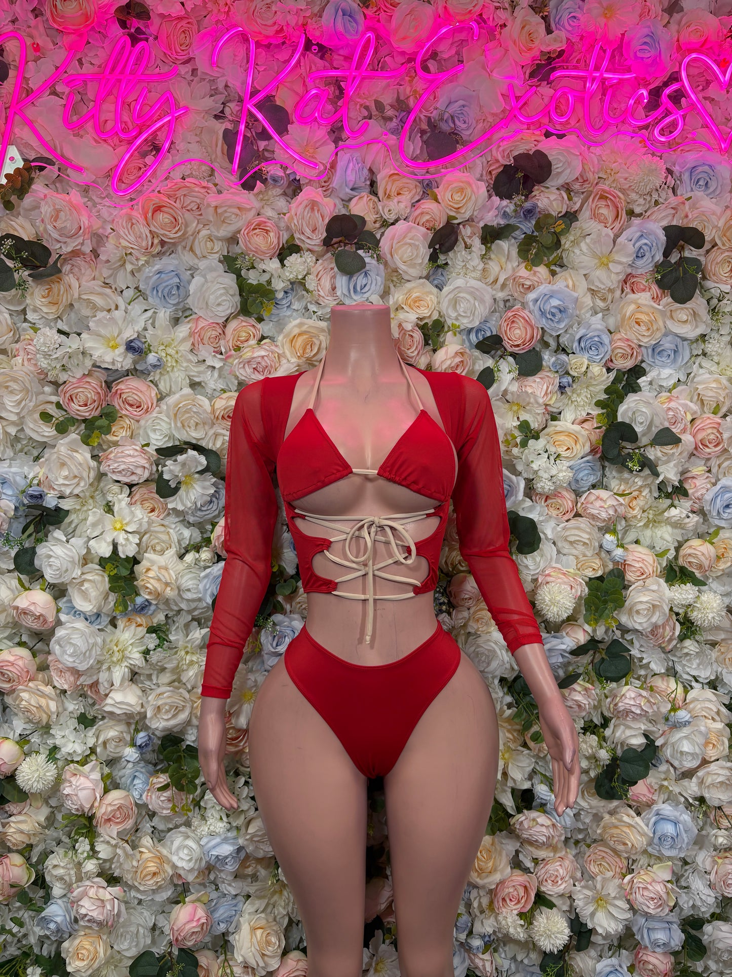 Red long-sleeve lace-up bodysuit with triangle bra top and high-cut bottoms