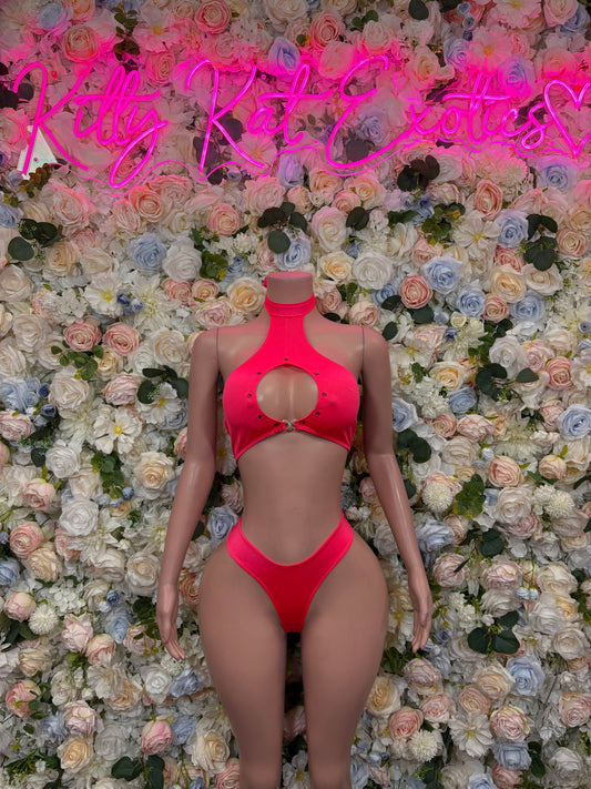 Coral pink cutout two-piece rave set with halter bra and thong bottom