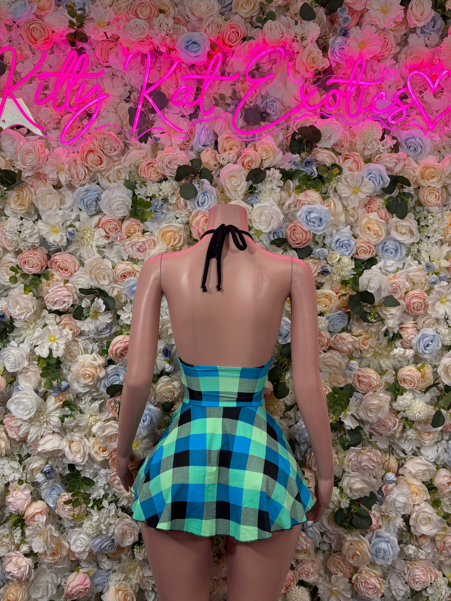 Blue-green plaid halter dress with tie-back straps and pleated skirt