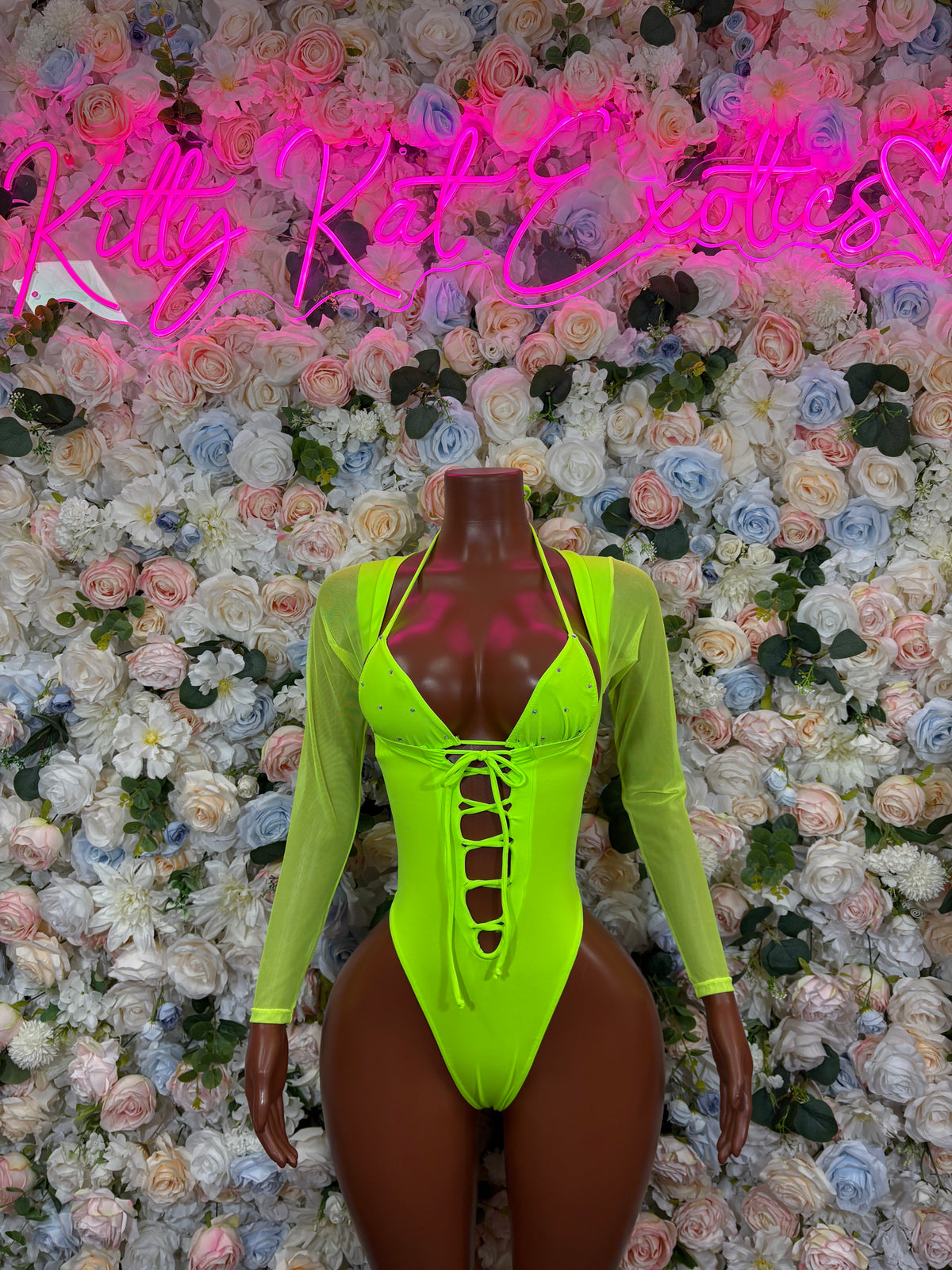 Neon green long-sleeve backless bodysuit with crisscross lace-up